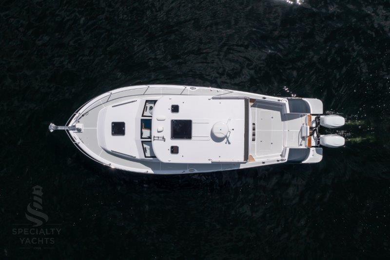 Aerial view of 2024 True North 34 yacht on dark water.