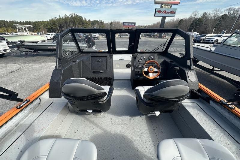 Interior view of 2026 SeaArk ProCat 240 boat with dual seats and dashboard.