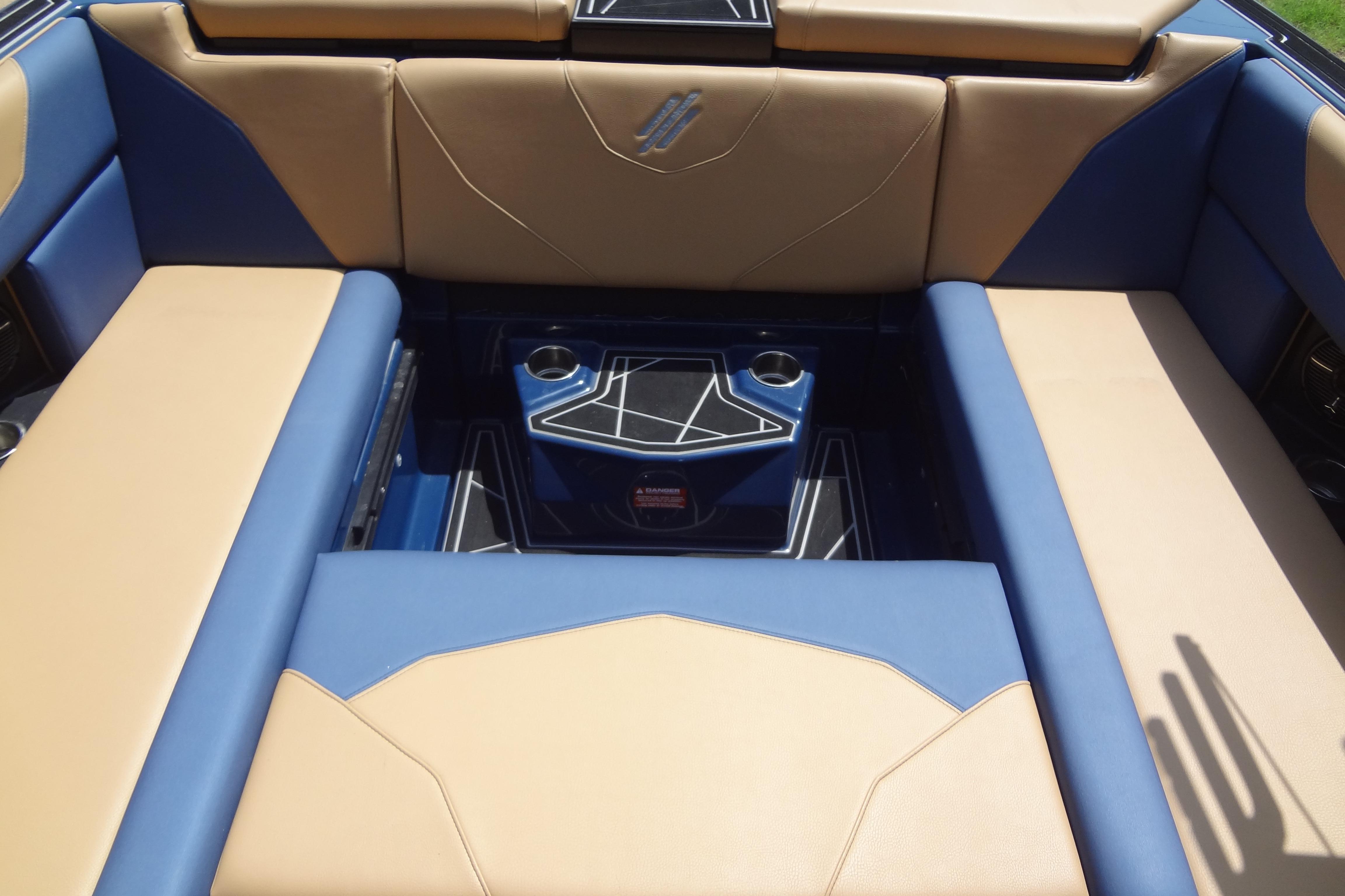 2022 ATX Surf Boats 24 Type-S interior with tan and blue seating.