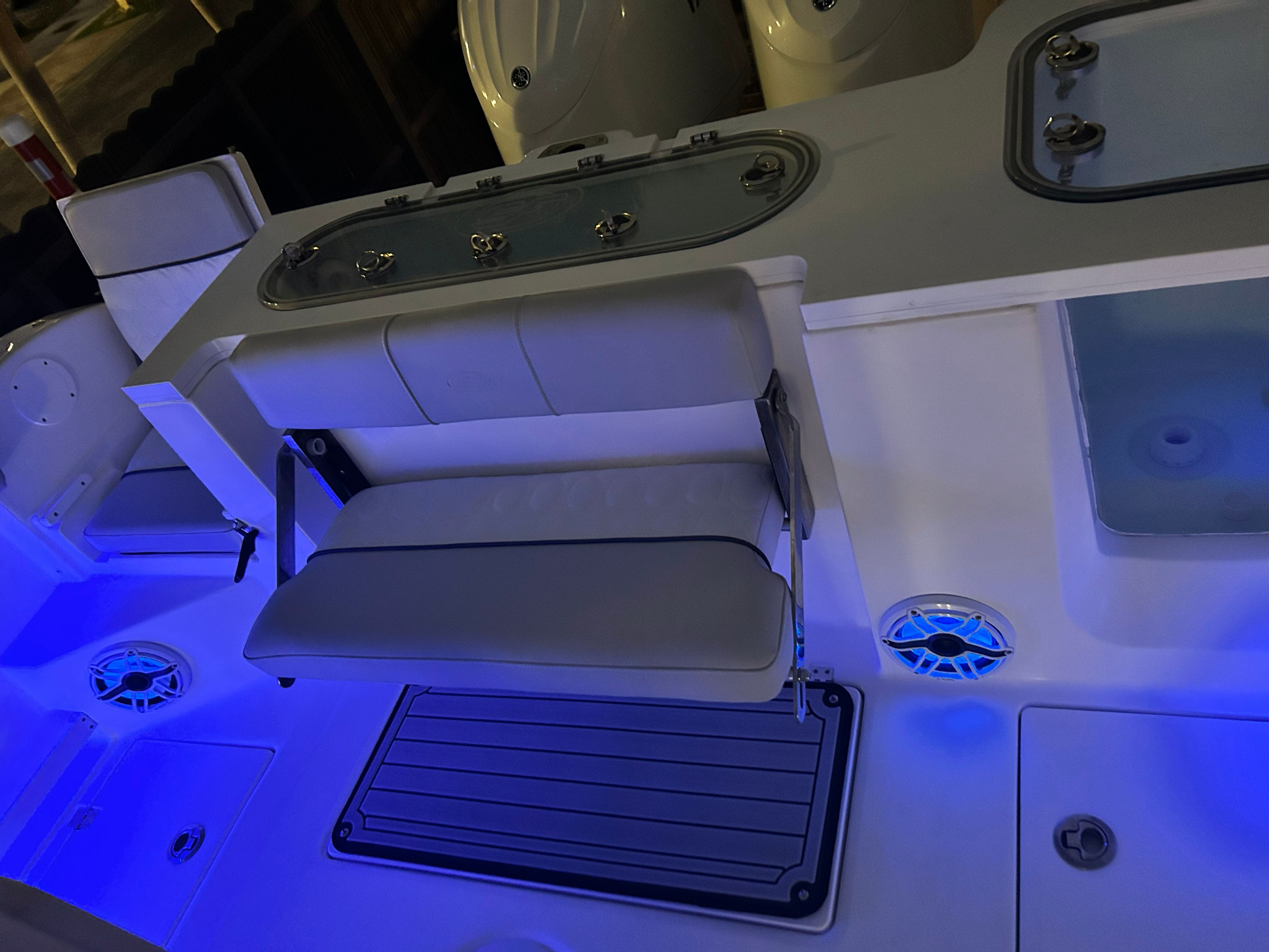 The image shows the cockpit of a Sea Fox 288 Commander with blue lighting.
