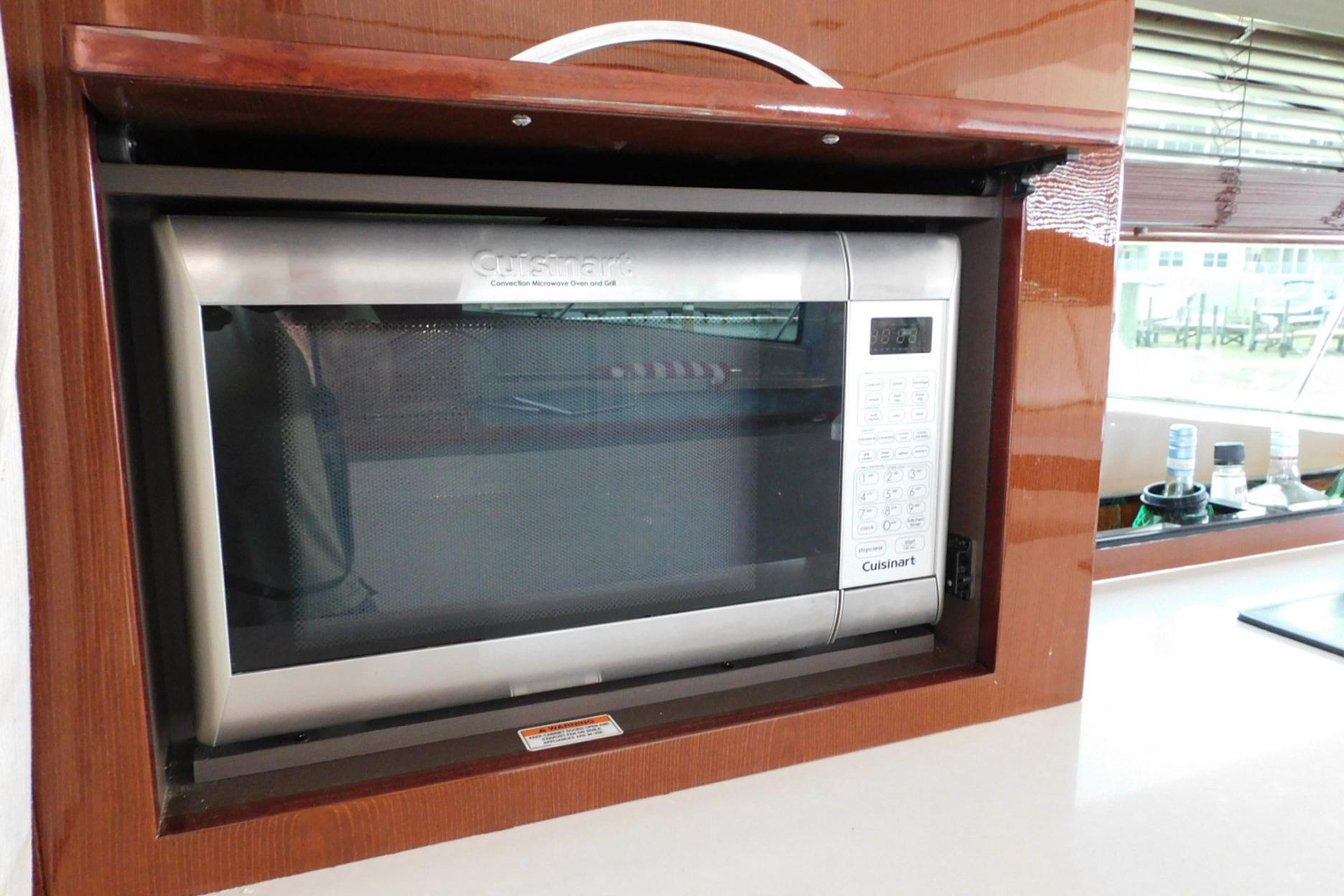 Built-in Cuisinart microwave in 2019 Sea Ray L550 yacht kitchen.
