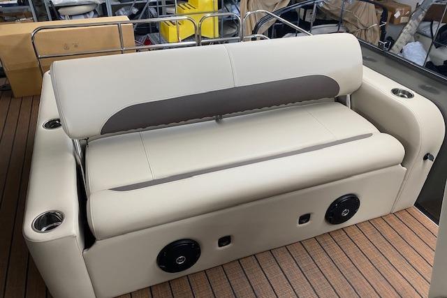 2026 Bentley Pontoons Legacy 223 Swingback seating with cup holders and speakers on deck.