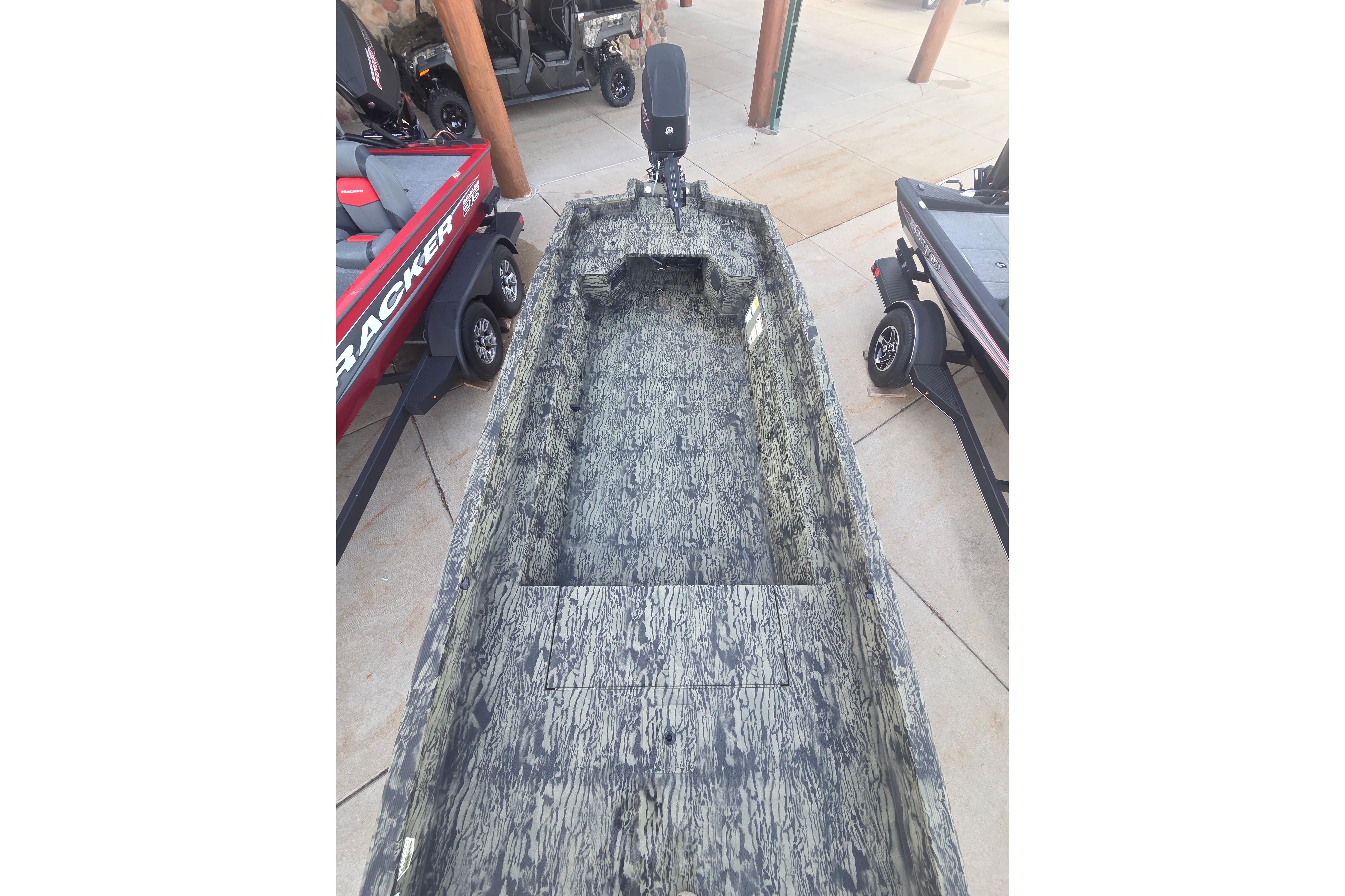 2026 Tracker Grizzly 1650 T Prairie Wings Edition boat with camouflage interior design.