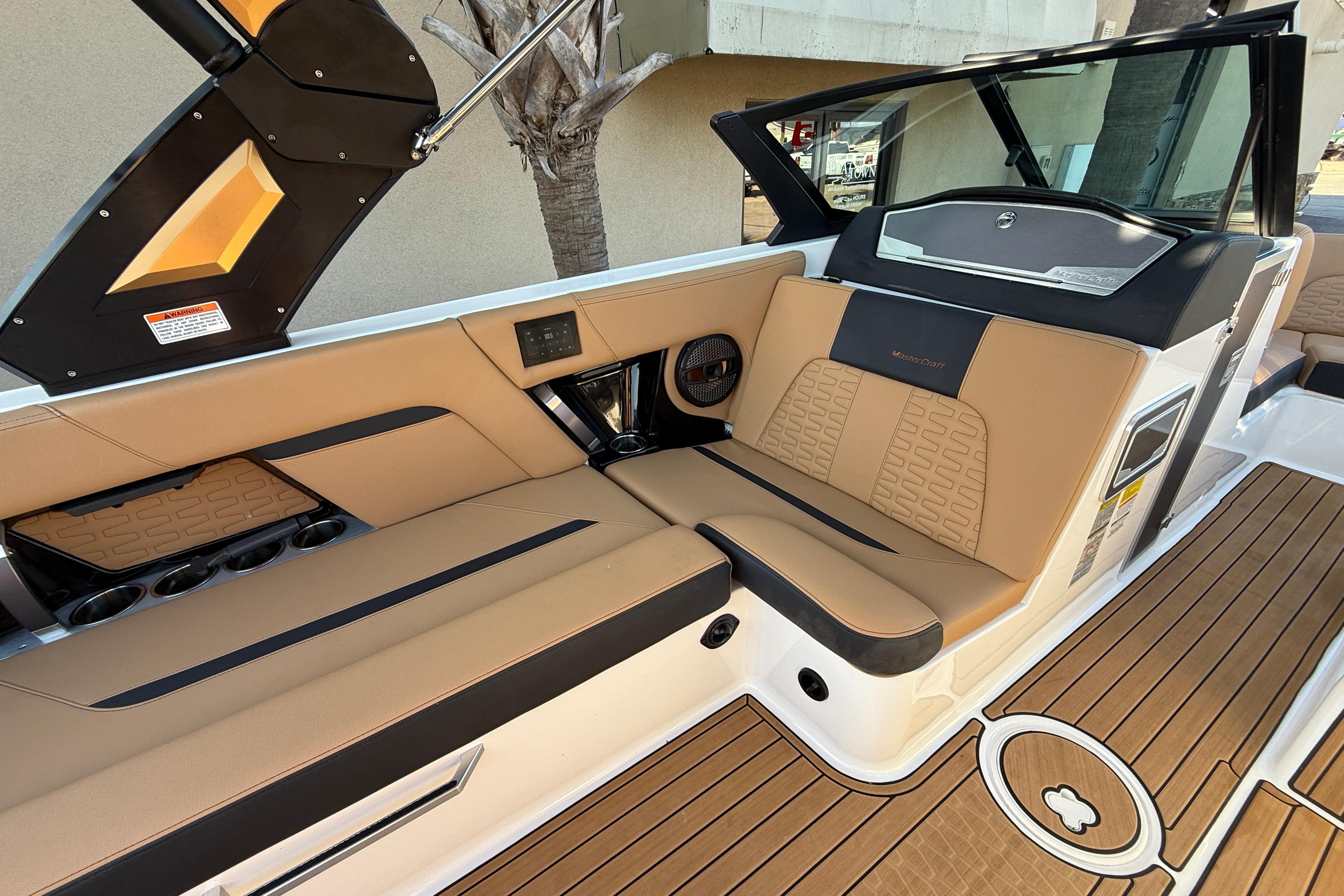 2023 MasterCraft X22 boat interior with tan seating and modern design.