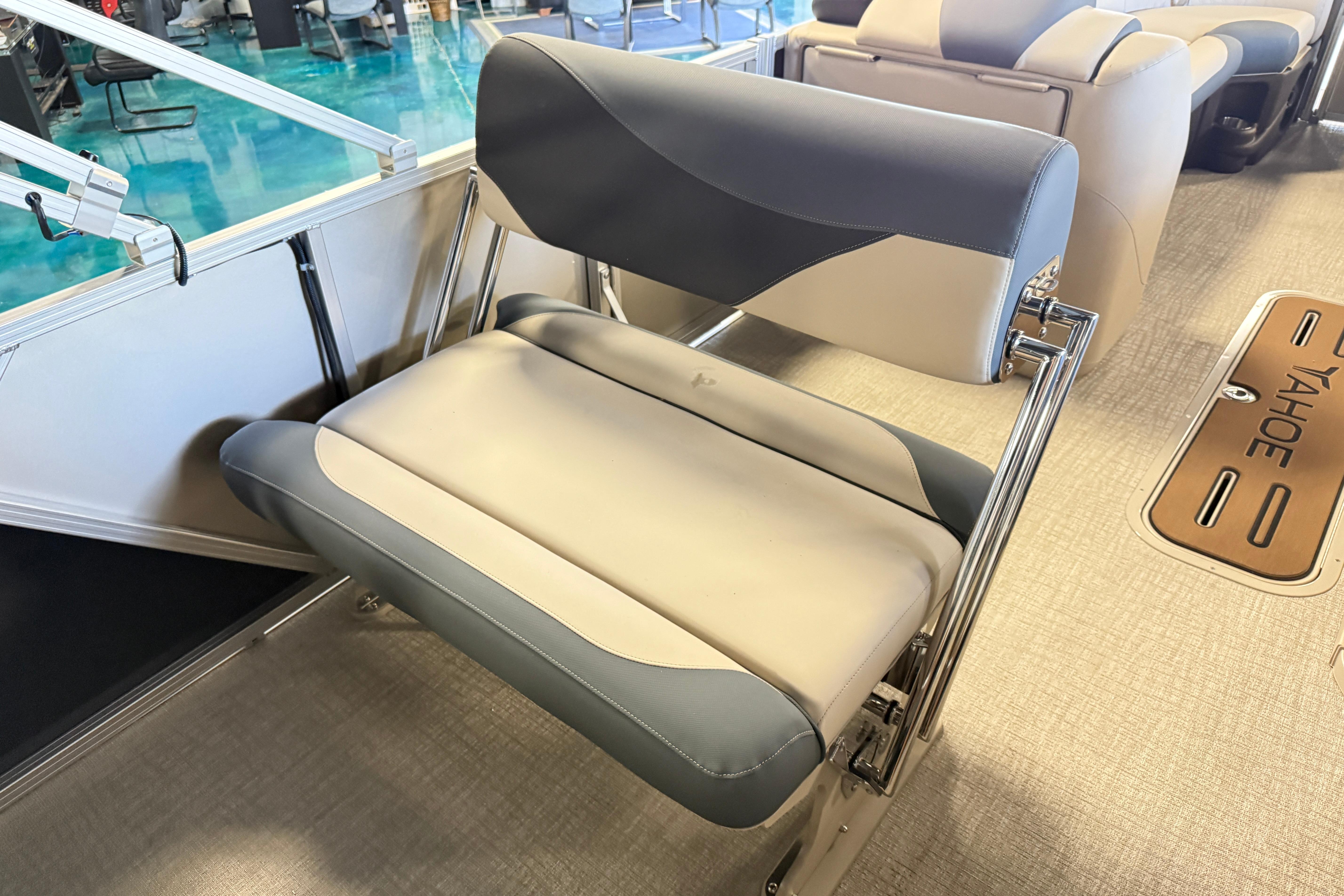 2026 Tahoe Pontoon LTZ Entertainer boat seat with sleek gray and beige design.