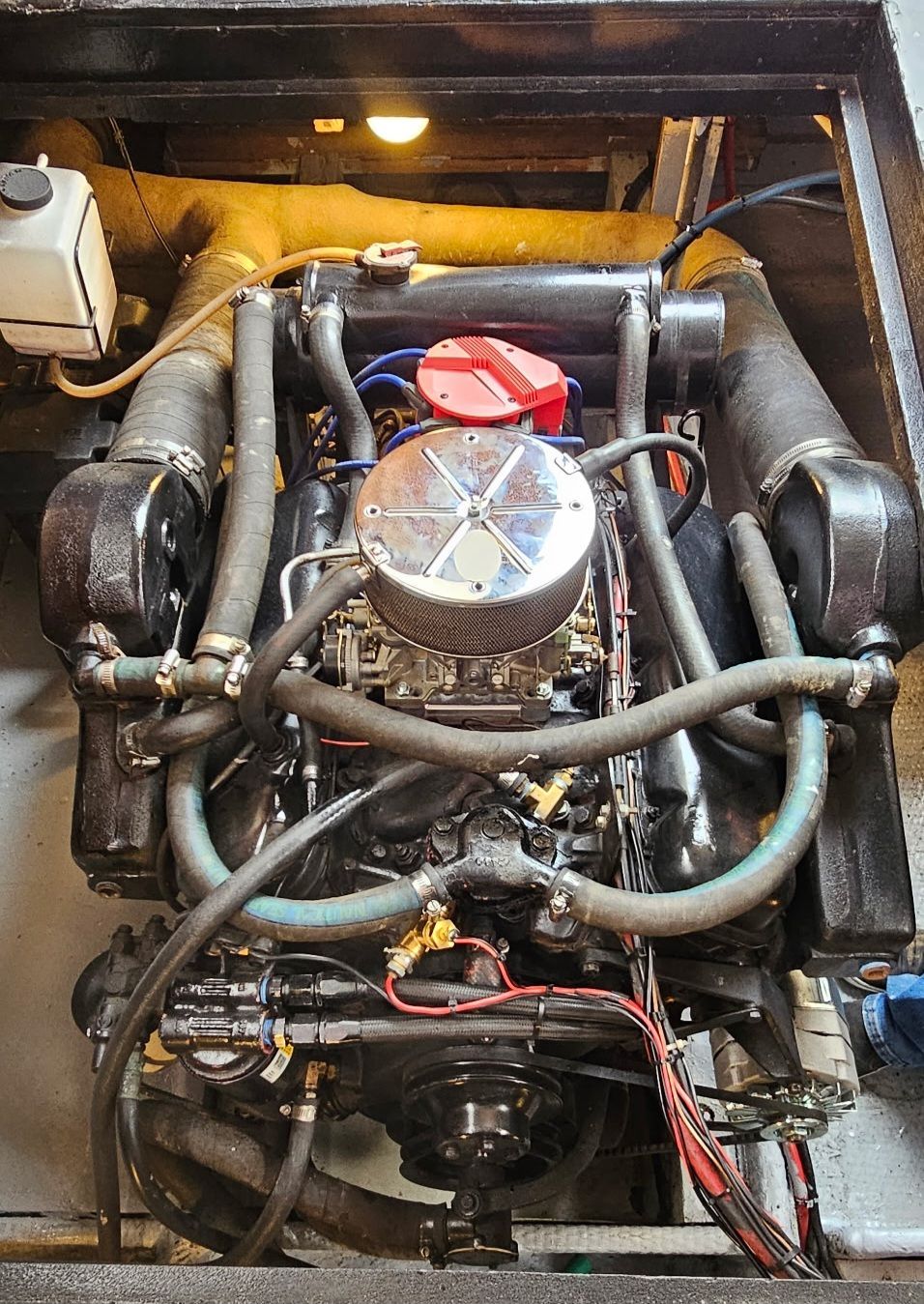 Engine of a 1976 Egg Harbor 33 Sportfisher boat, close-up view.