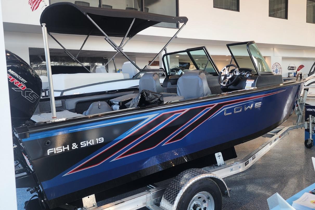 2023 Lowe Fish & Ski 19 boat with Mercury Pro XS engine on display.