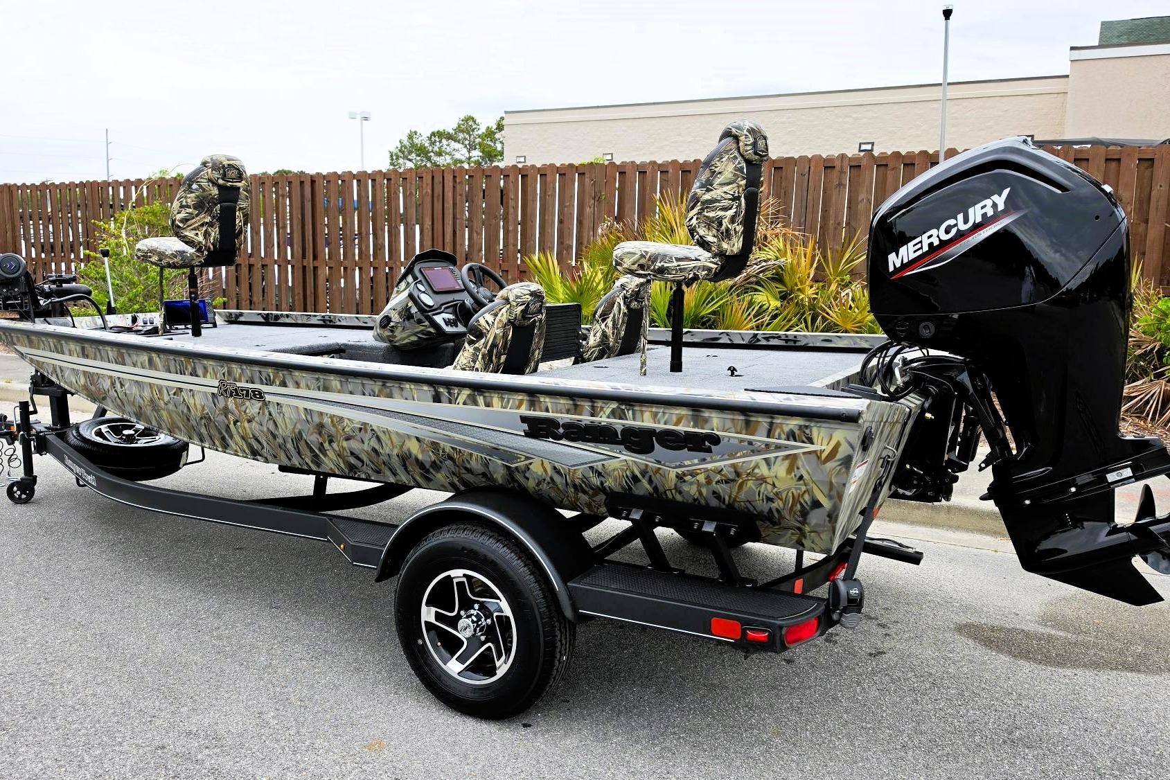 2026 Ranger RT178 fishing boat with camo seats and Mercury outboard motor.