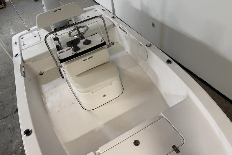 2026 Sea Pro 172 Bay boat interior with steering console and seating.