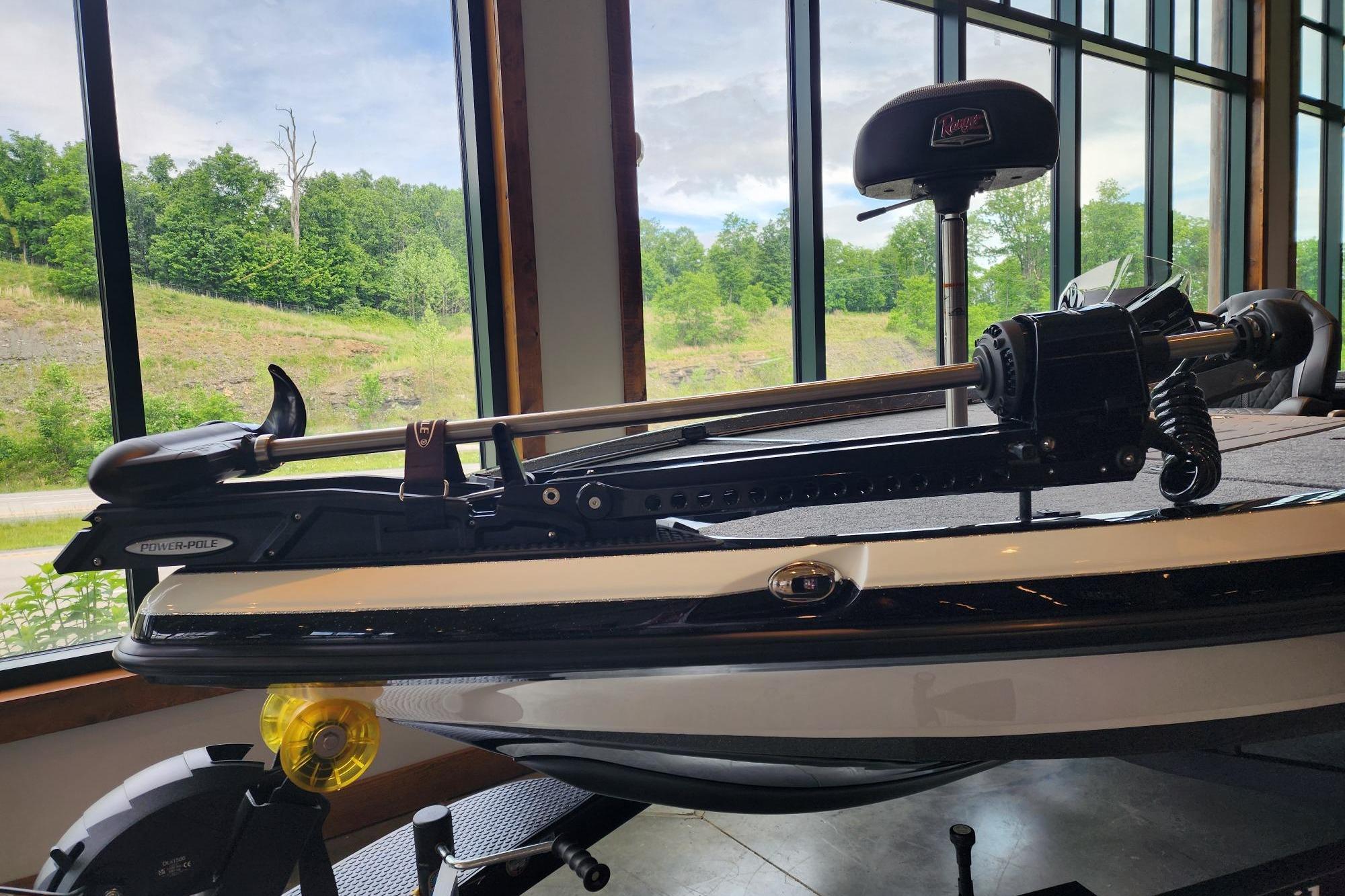 2026 Ranger Z520R boat with Power-Pole, displayed indoors near large windows.