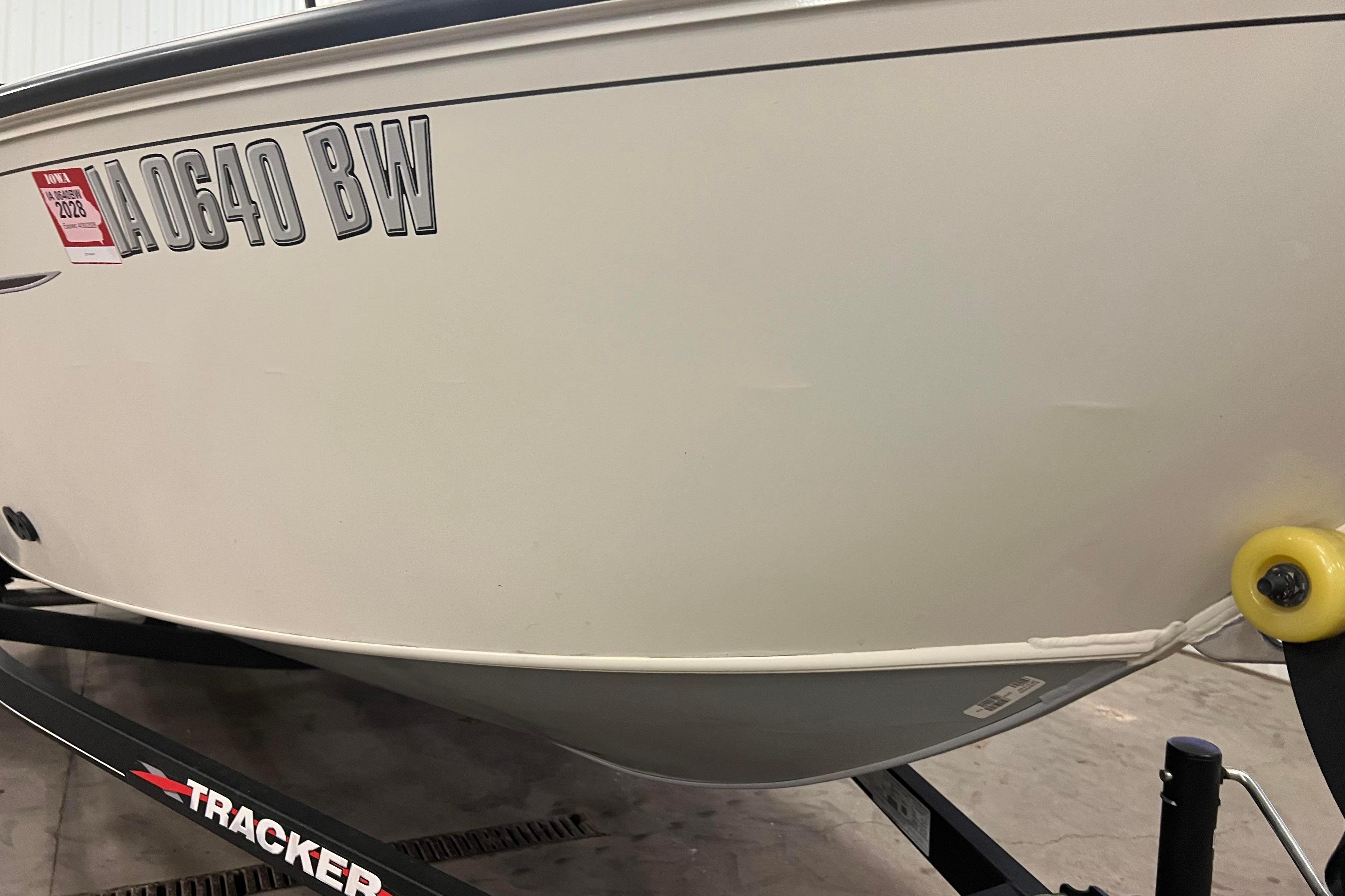 2022 Tracker Pro Guide V-16 WT boat on trailer, registration visible.