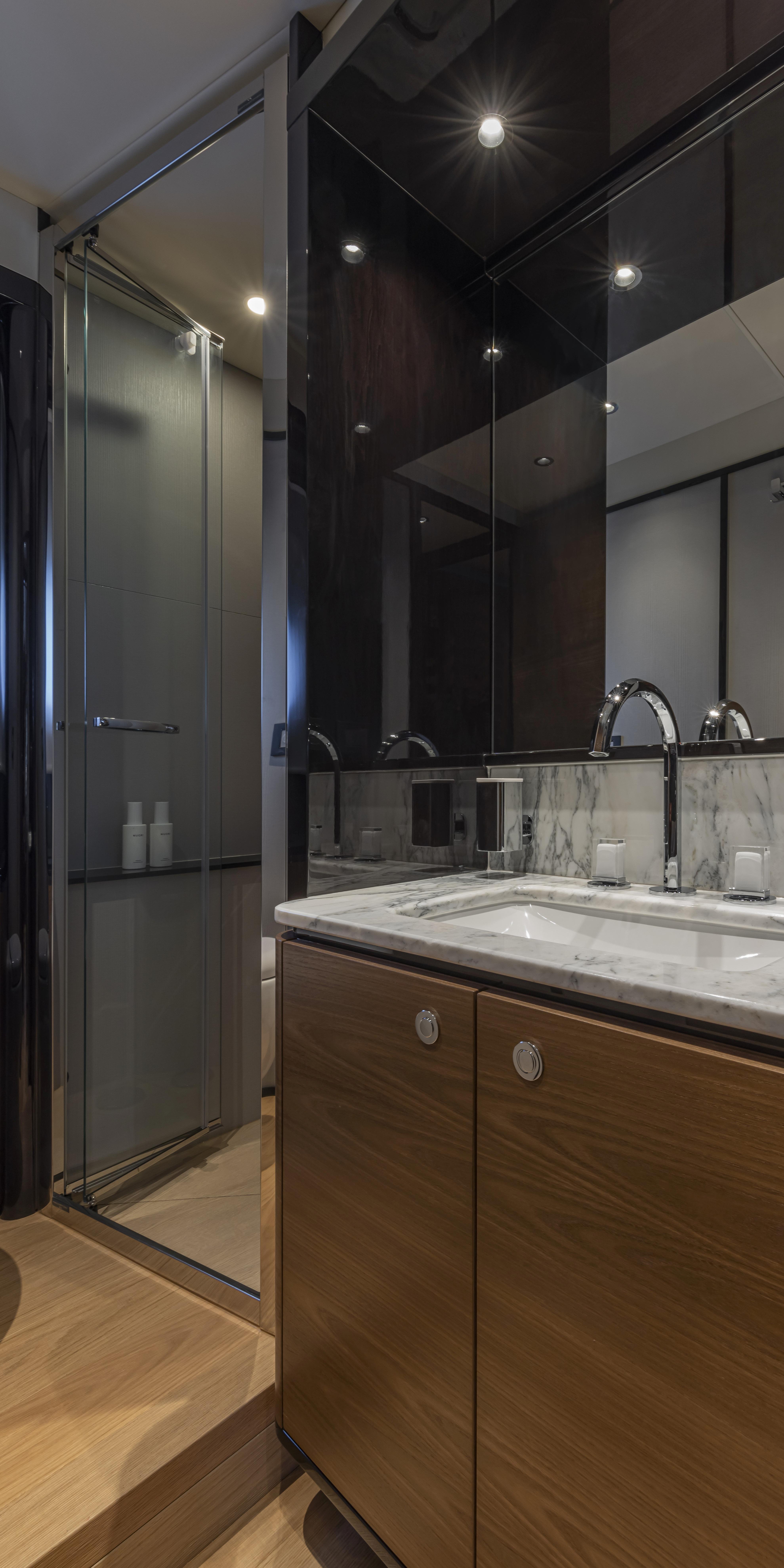 Modern bathroom in Absolute NAVETTA 75 yacht, 2025 model, featuring sleek design and luxury finishes.