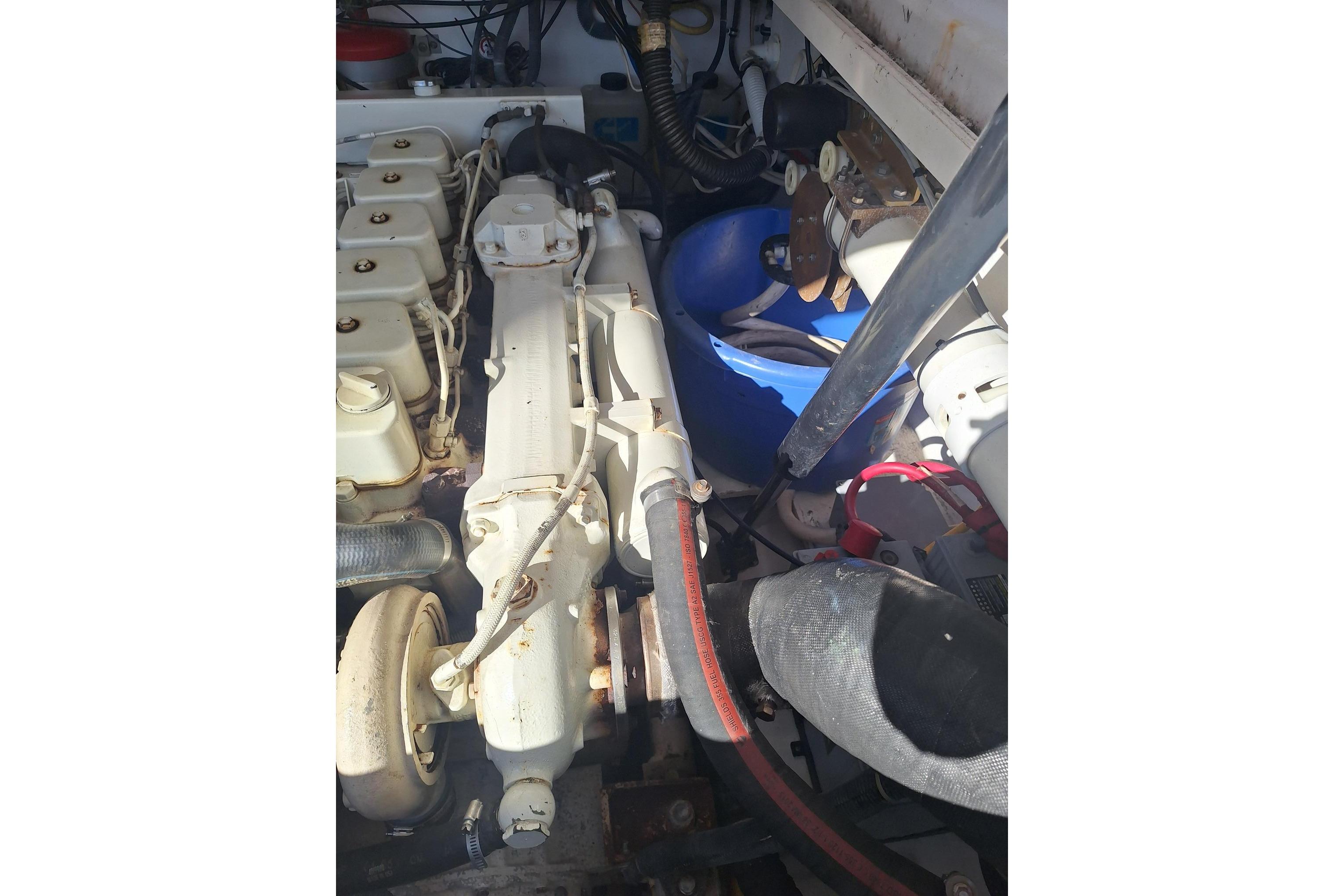 Engine compartment of a 2002 Tiara Yachts 3500 Open, showcasing mechanical components.