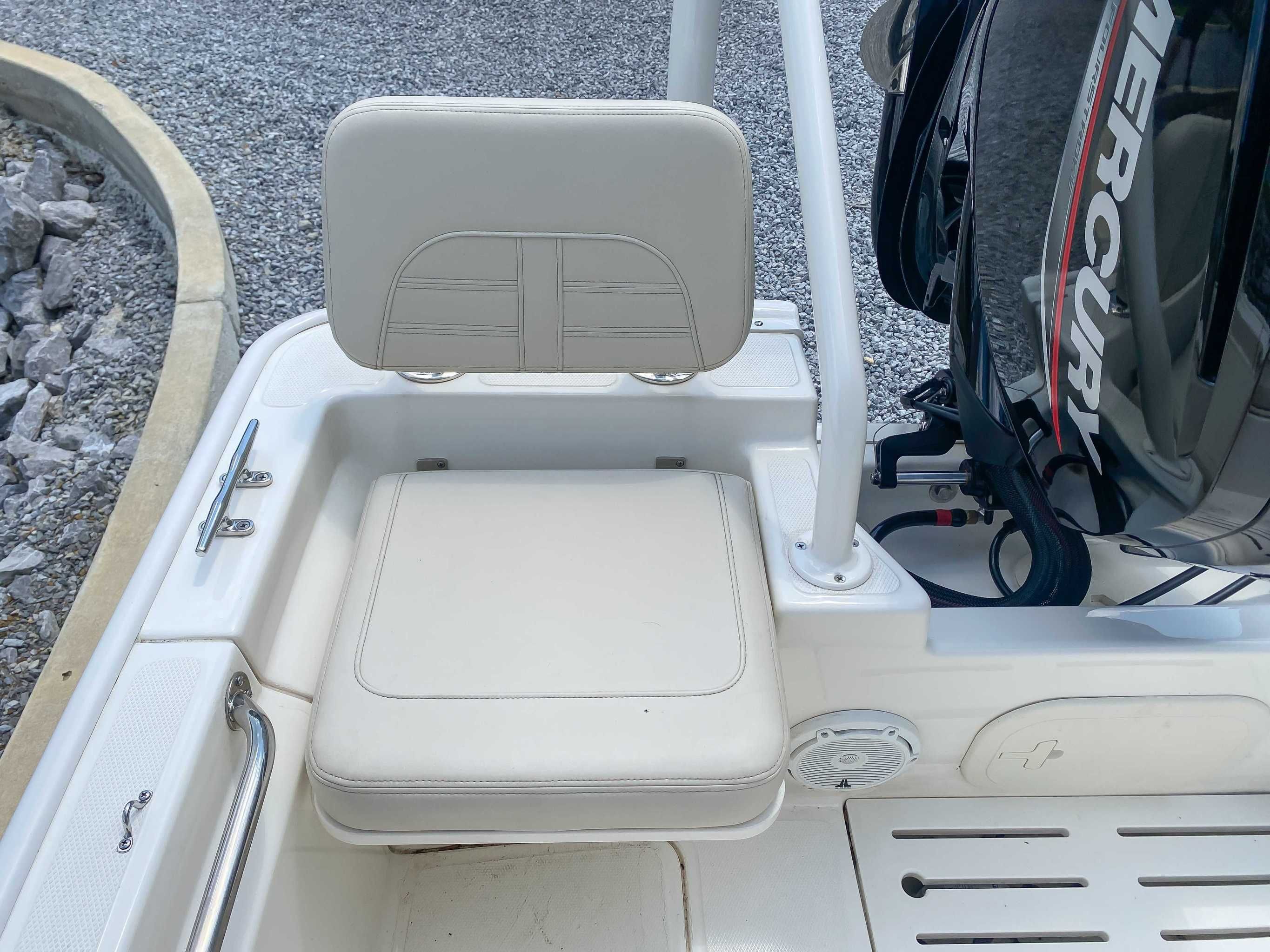 Boston Whaler 170 Montauk 2025 boat seat and engine view.