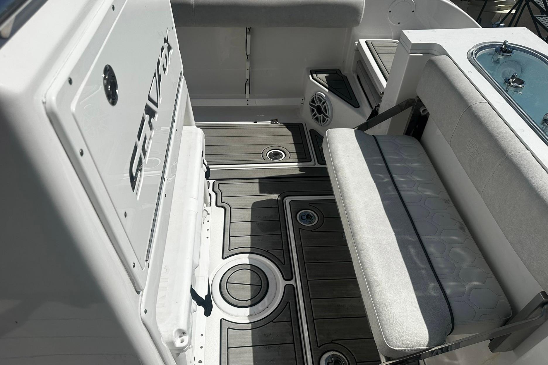 Sea Fox 228 Commander 2002 boat interior with seating and deck details.