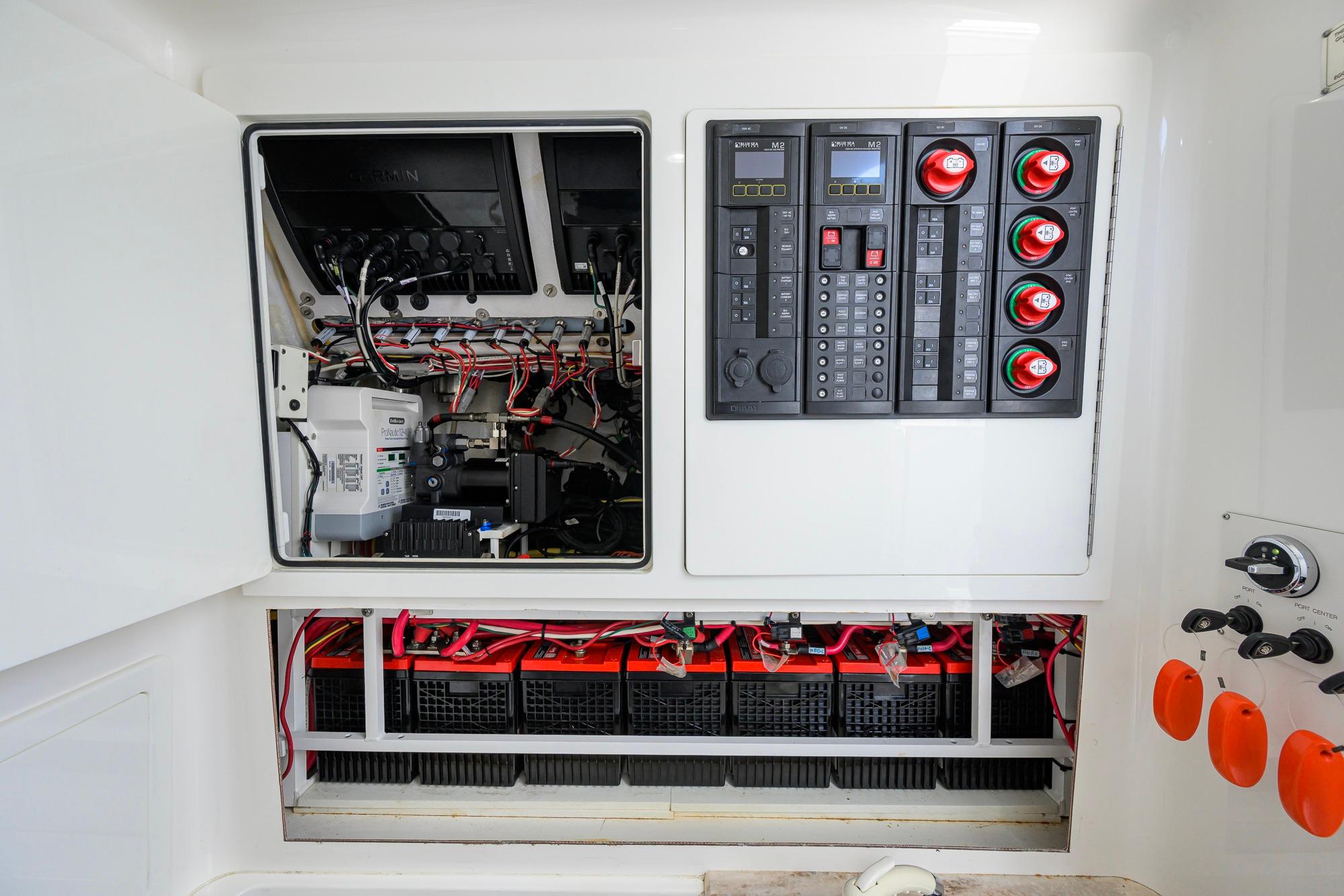 Electrical panel and wiring inside a 2020 Valhalla Boatworks V-41, showcasing organized components.
