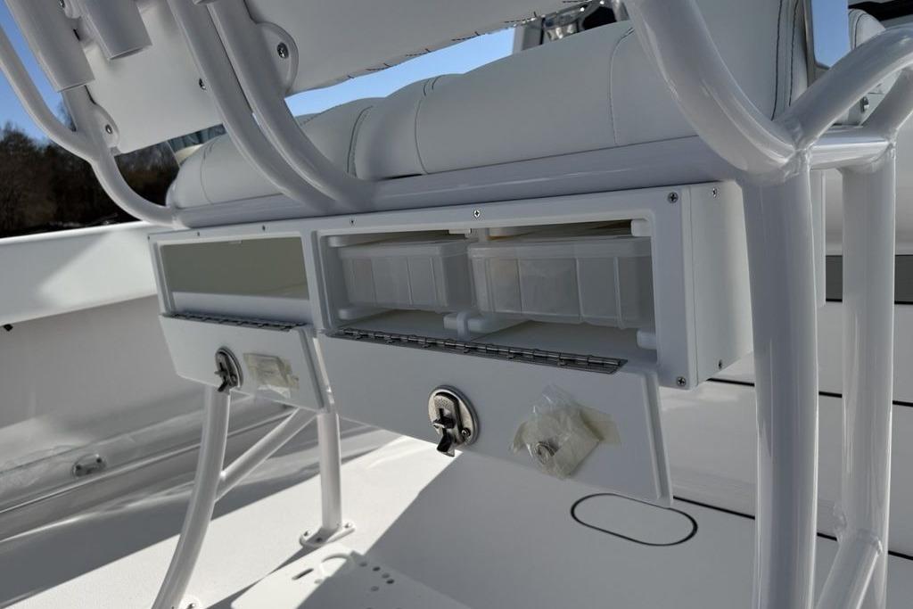 2026 Sportsman Open 232 Center Console boat storage compartments and seating detail.