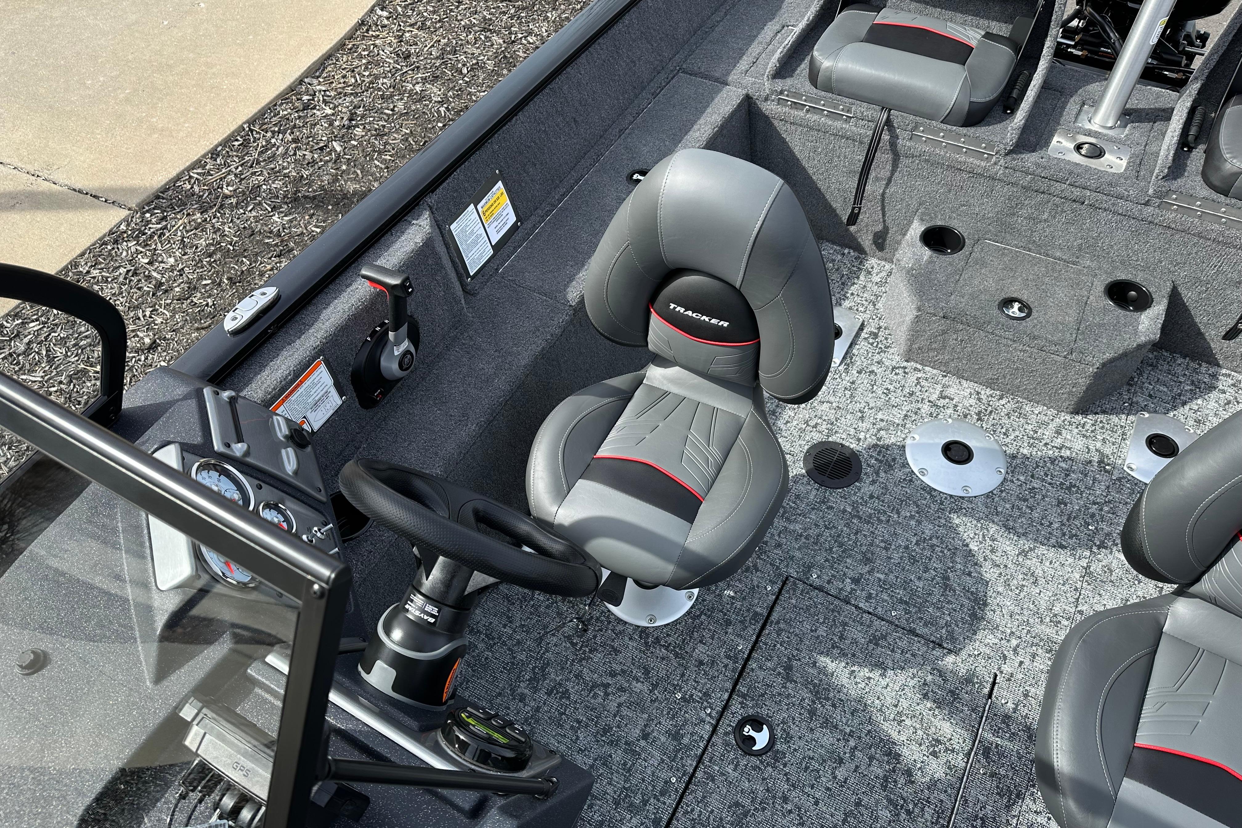 2026 Tracker Pro Guide V-175 Combo boat interior with gray seating and steering console.