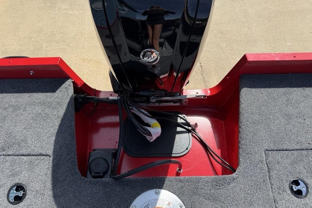 2026 Tracker Pro Guide V-16 SC boat interior with motor and carpeted deck.