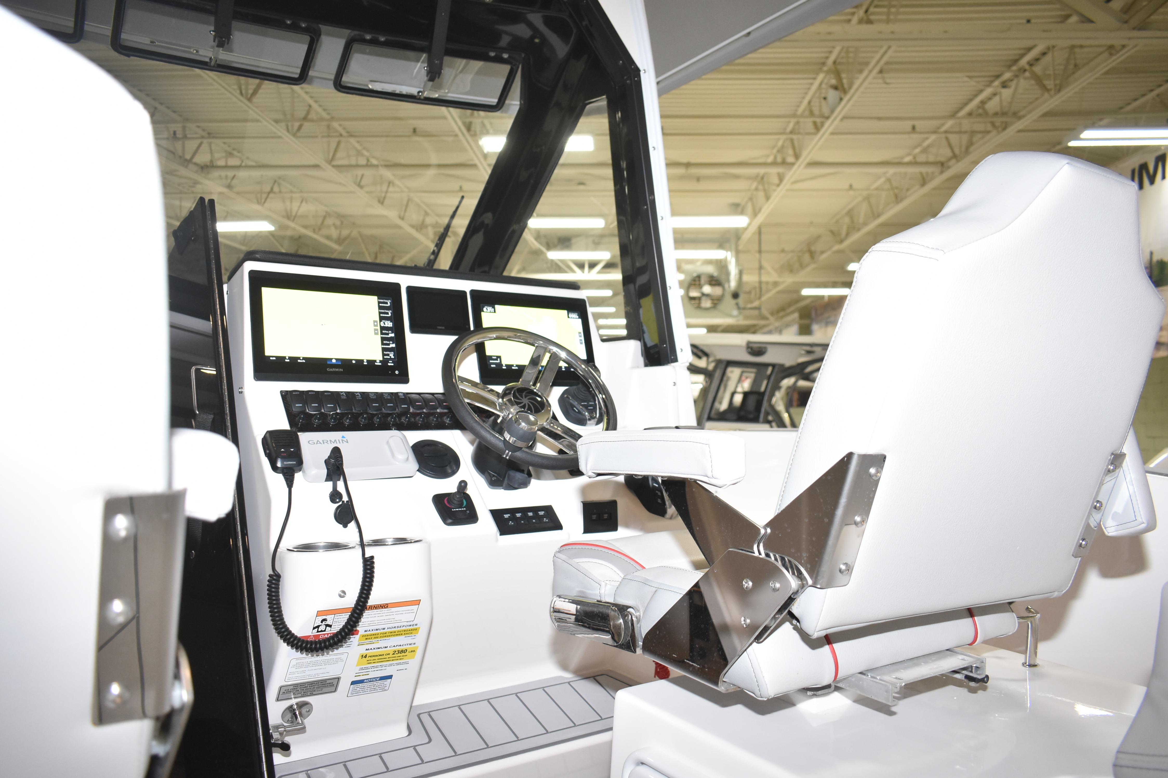 Interior cockpit of 2025 Solara S-310 CW boat with modern controls and steering.