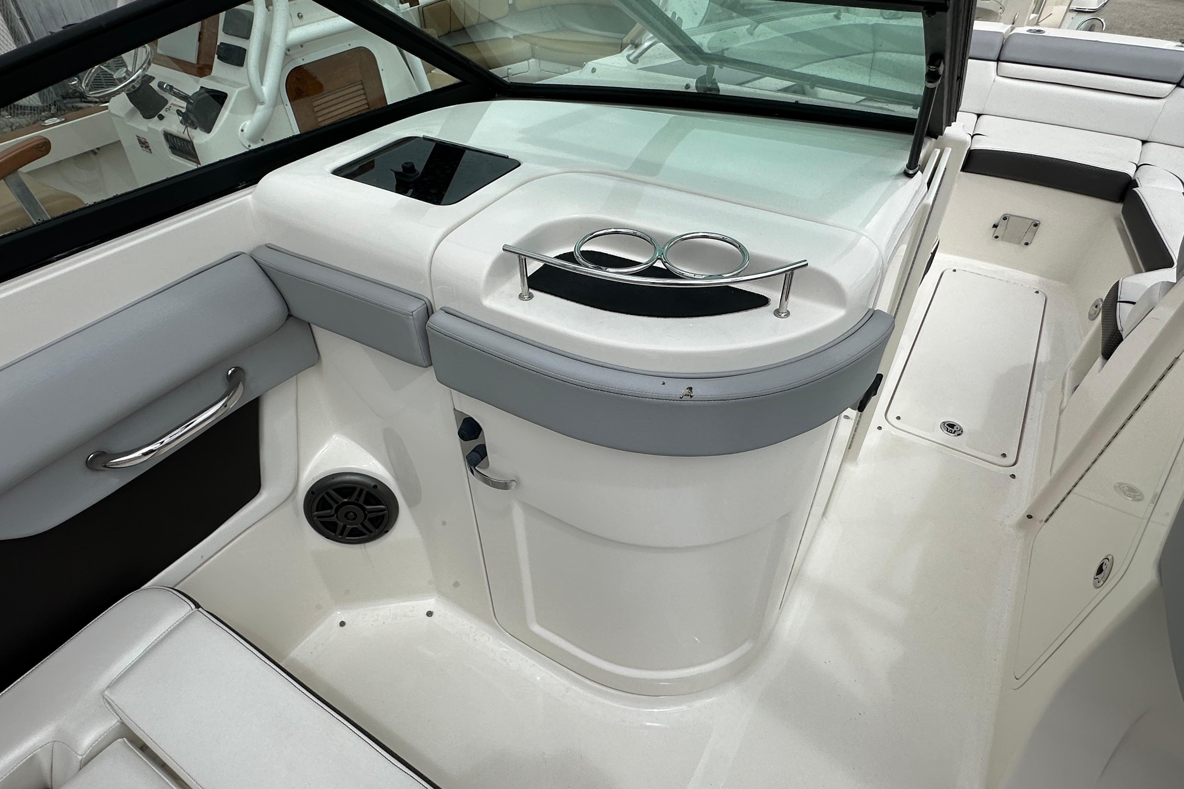 2016 Sea Ray 270 Sundeck interior with seating, cup holders, and speaker.