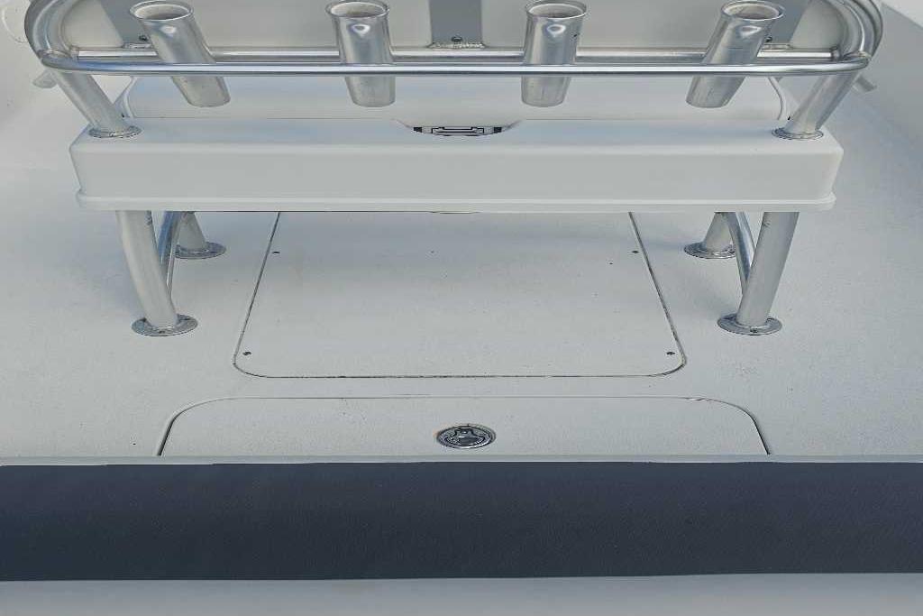2009 Ranger 2200 Bay Ranger boat deck with rod holders and storage compartments.