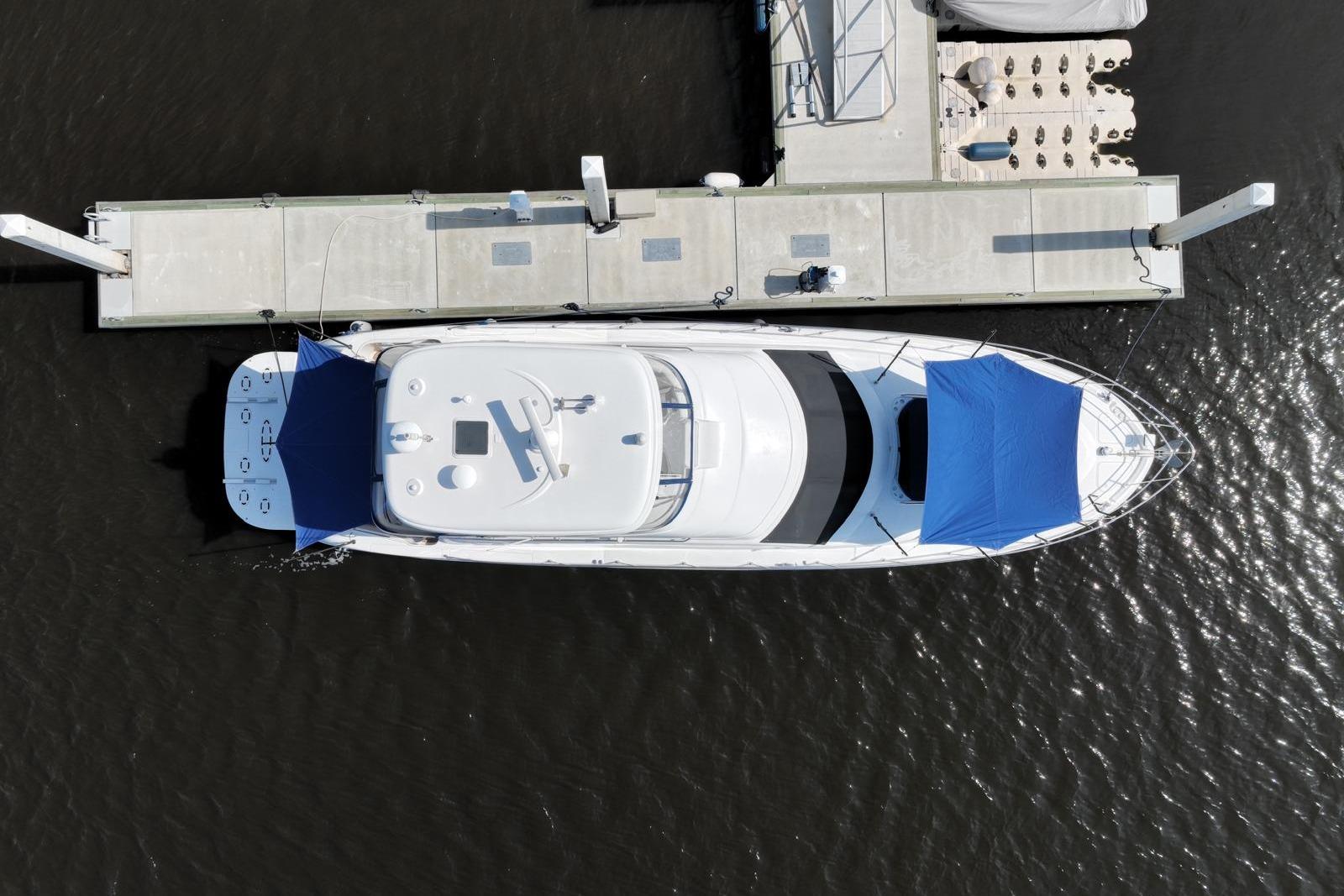 Aerial view of 2006 Sea Ray 580 Sedan Bridge yacht docked at marina.