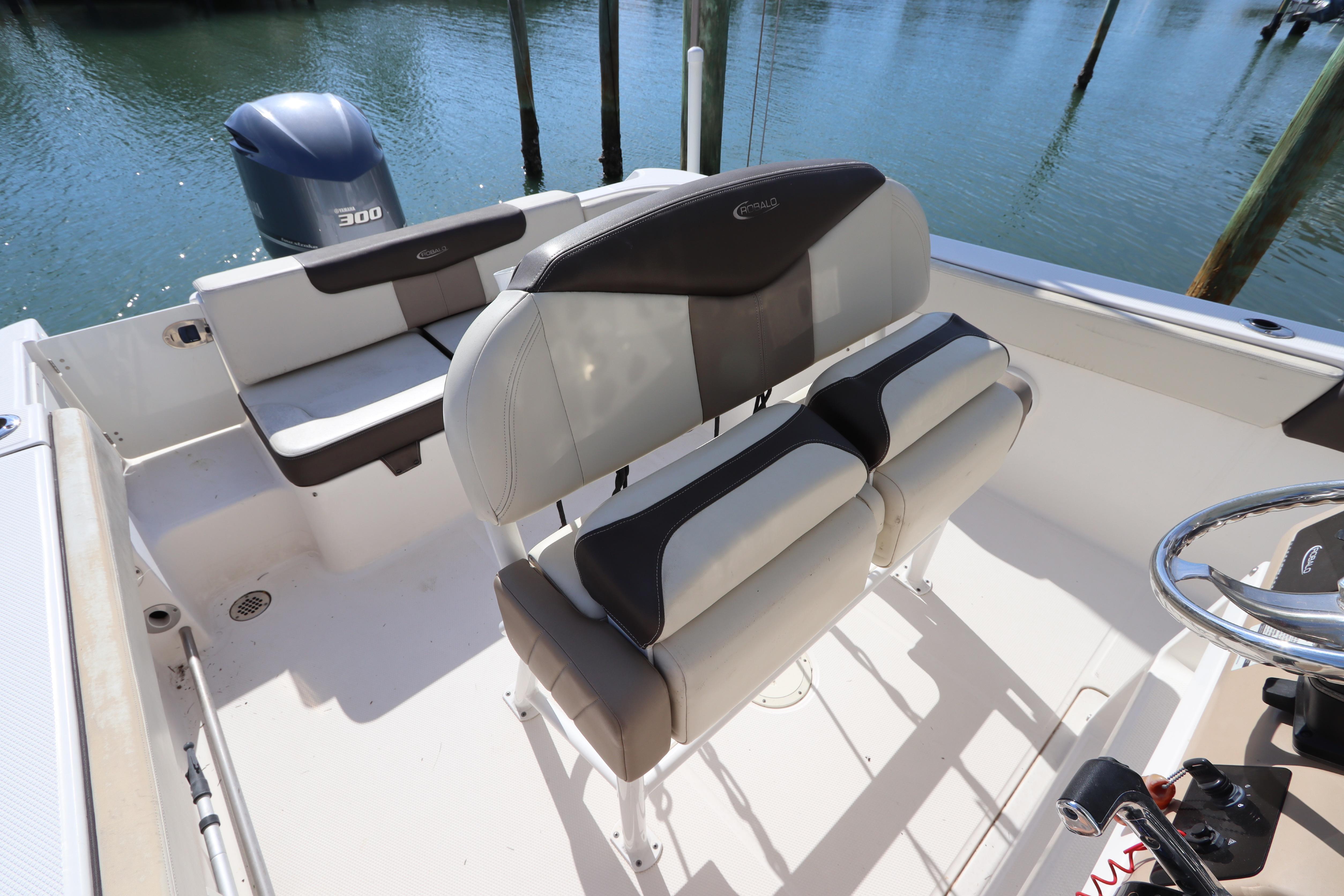 2019 Robalo R242 Center Console boat interior with seating and steering wheel.