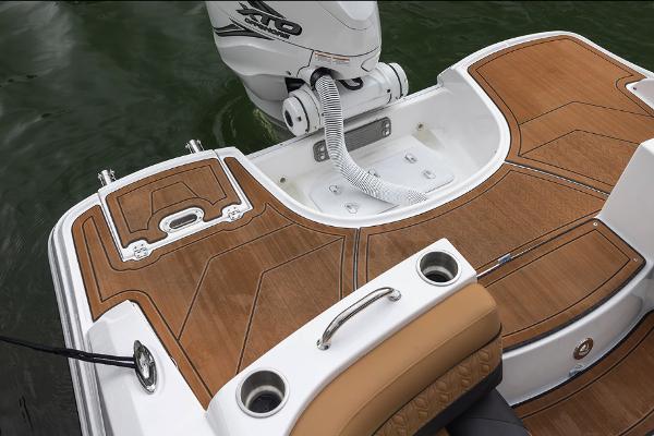 Manufacturer Provided Image: 2026 Hurricane SunDeck 2690 OB boat deck with teak flooring and outboard motor.