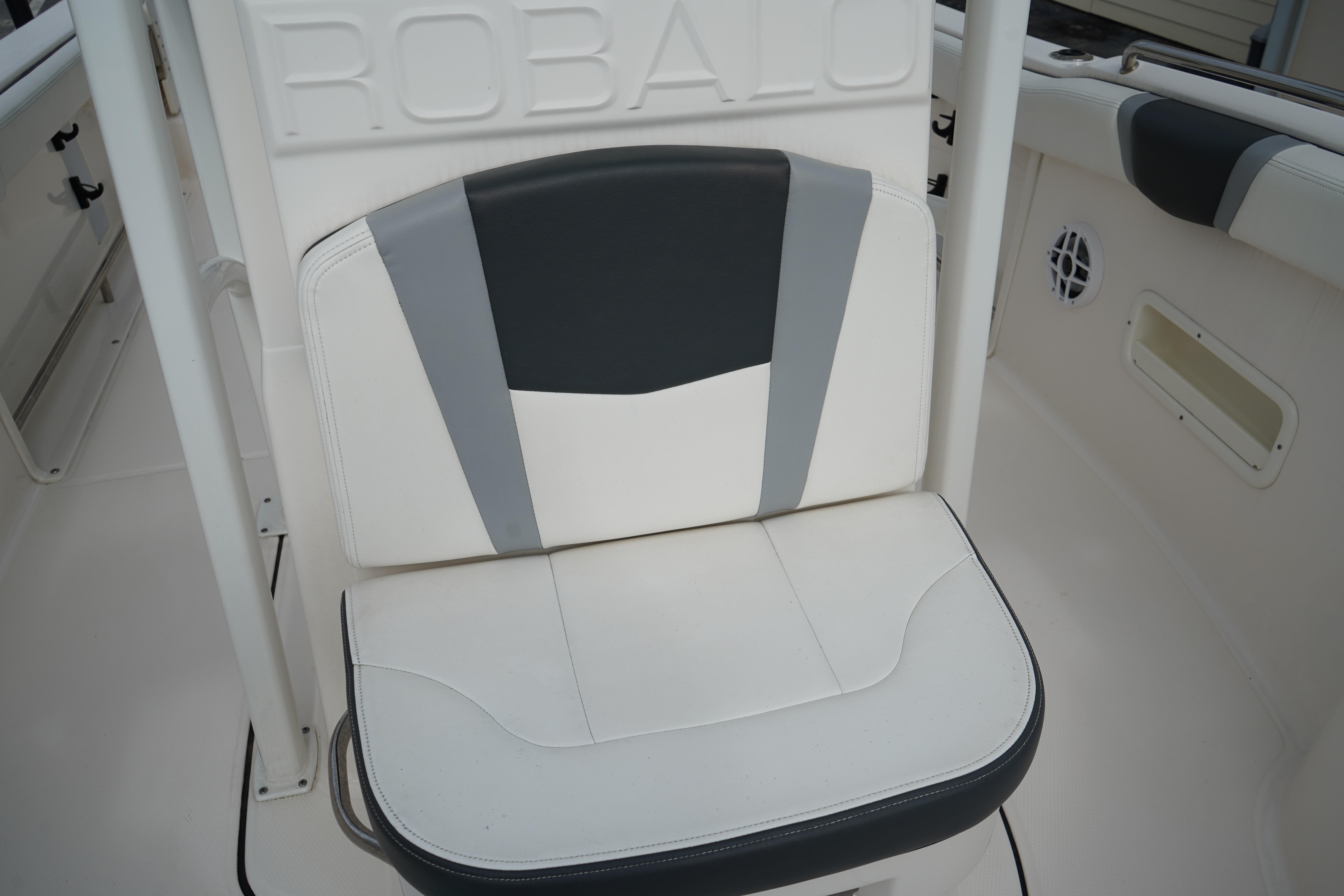 2023 Robalo R222 Center Console boat seat with stylish white and gray upholstery.