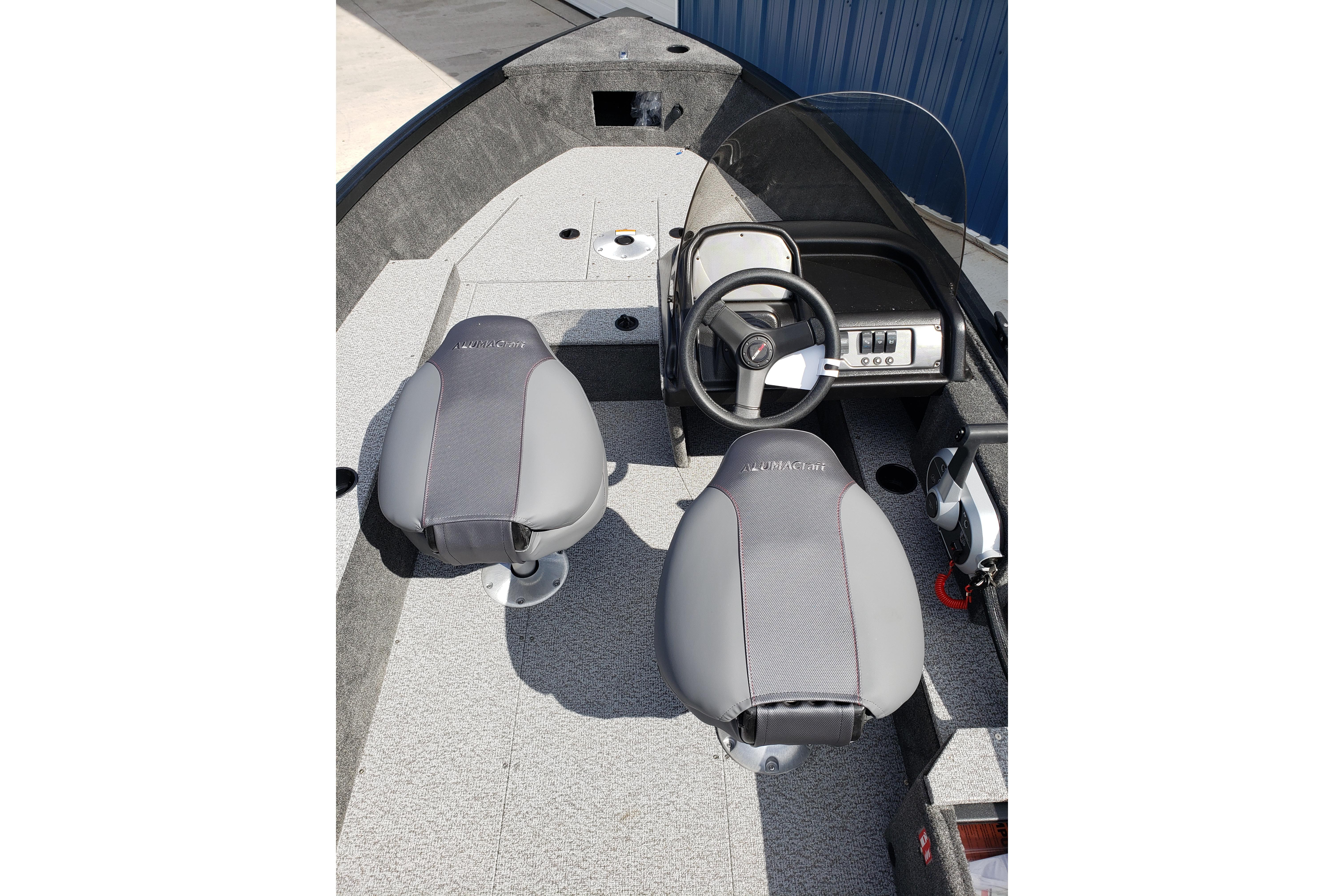 2026 Alumacraft Escape 165 CS boat interior with steering wheel and two seats.