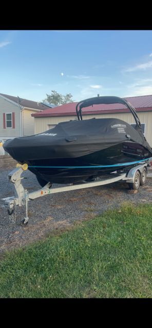 2021 Yamaha 212S boat parked on a trailer outdoors.