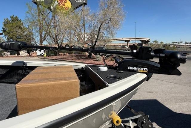 2026 Ranger VS1882SC Reata boat with Minn Kota trolling motor in a parking lot.