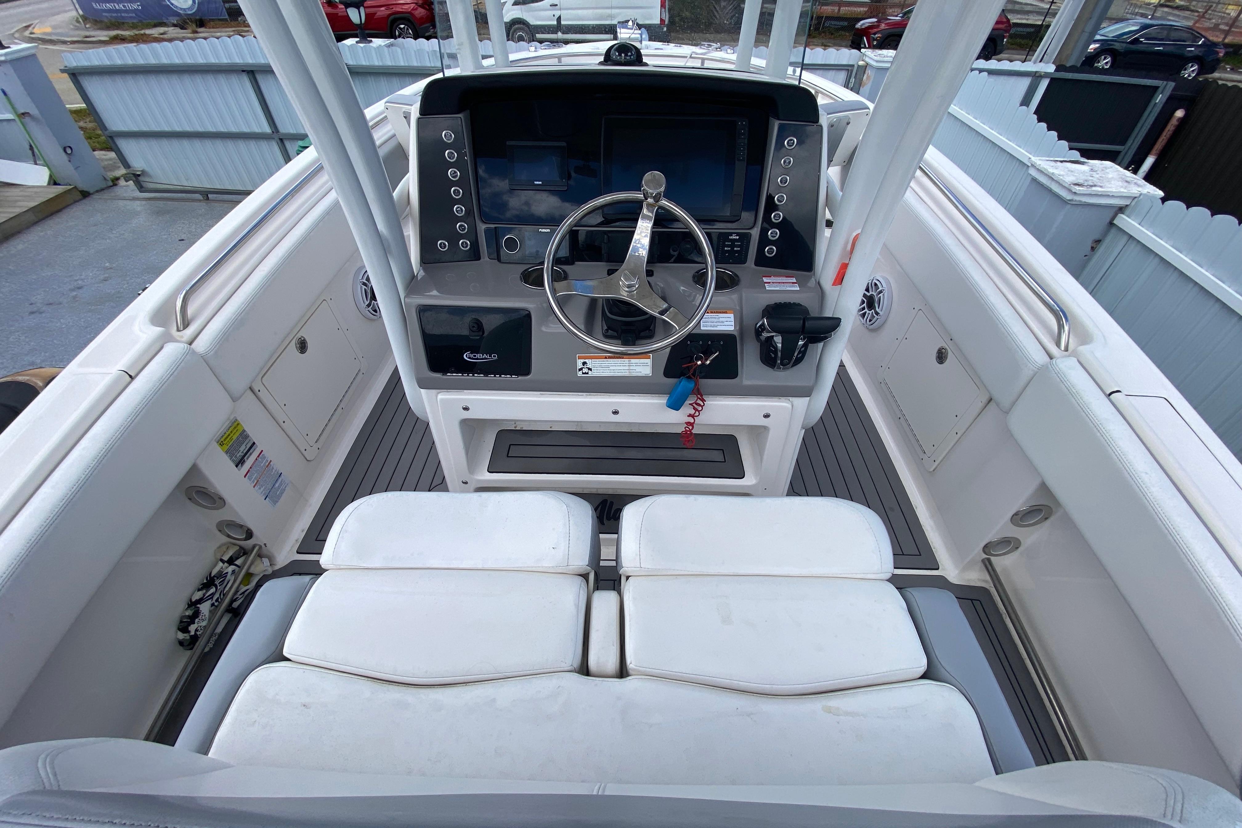 2022 Robalo R242 Center Console boat interior with steering wheel and seating.
