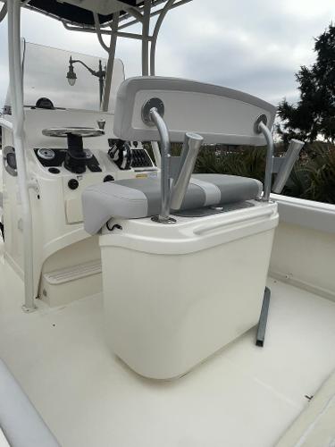 2024 Mako 214 CC center console boat interior with seating and control panel.