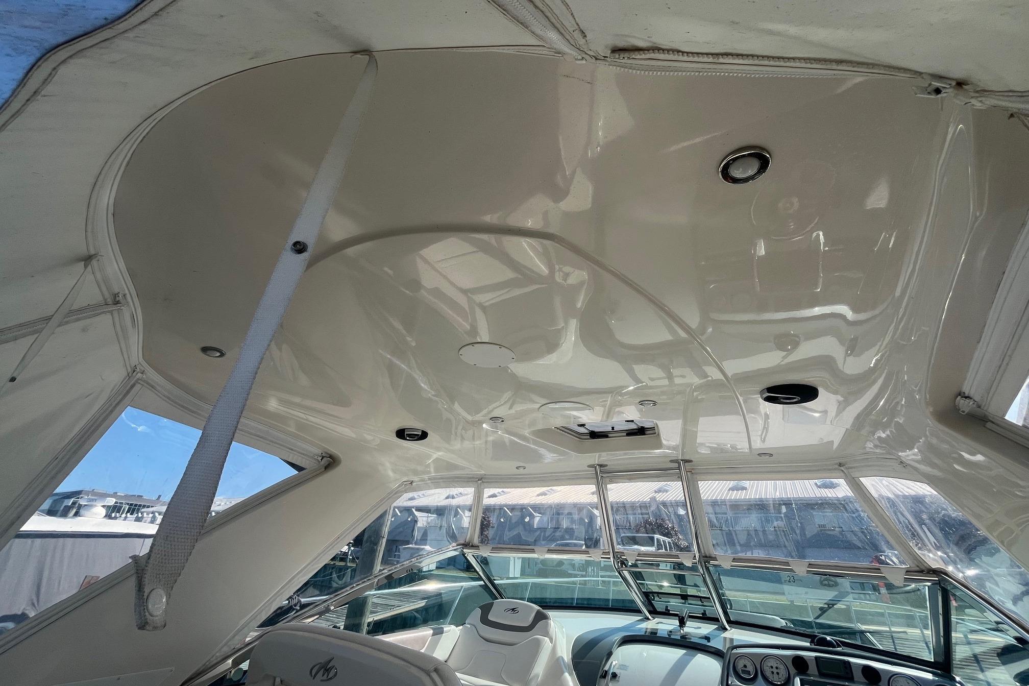Interior view of 2010 Monterey 400 Sport Yacht cockpit with sleek design and modern controls.