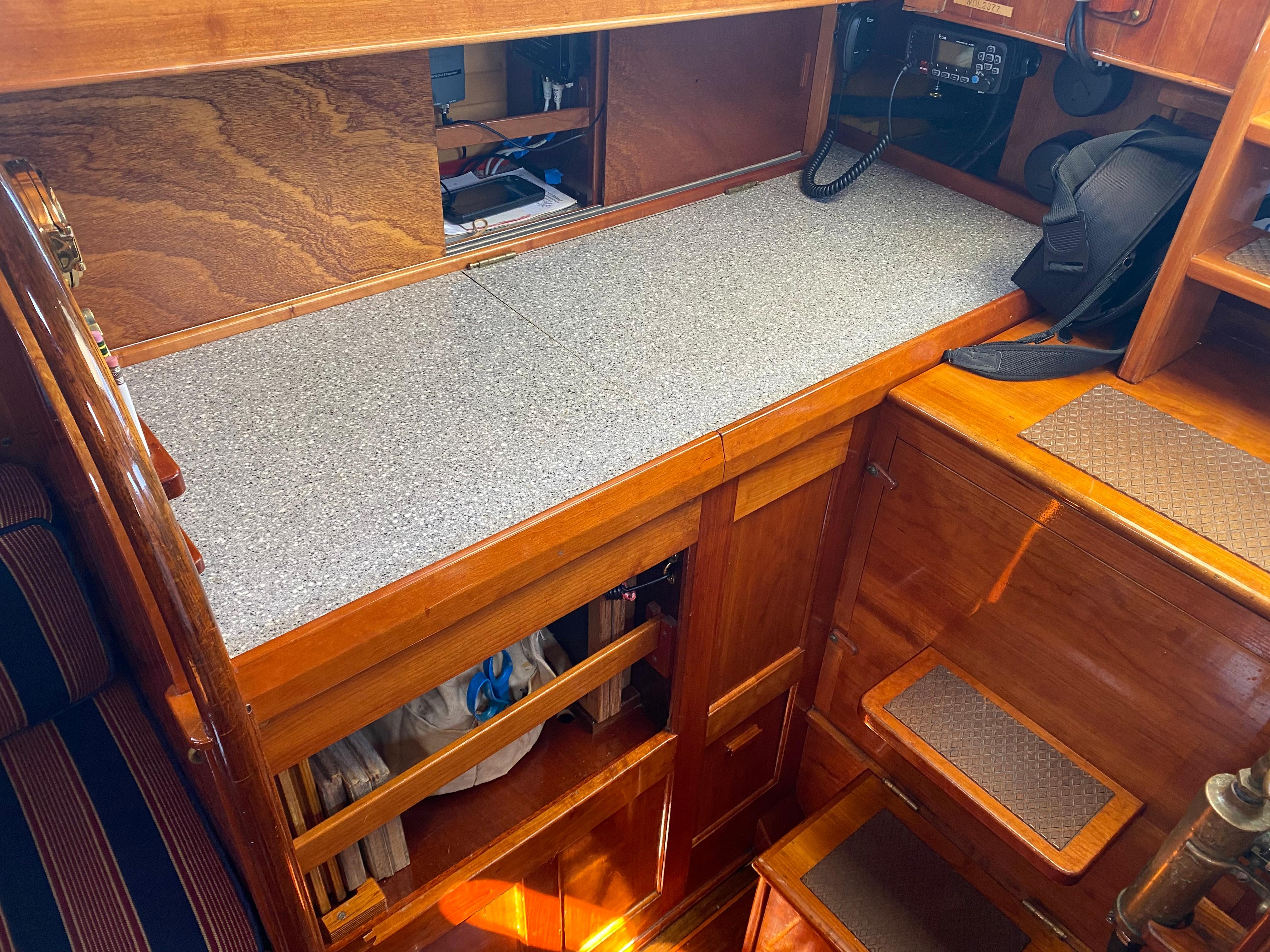 Interior of 2010 Laurent Giles Vertue Class Sloop with wooden cabinetry and countertop.