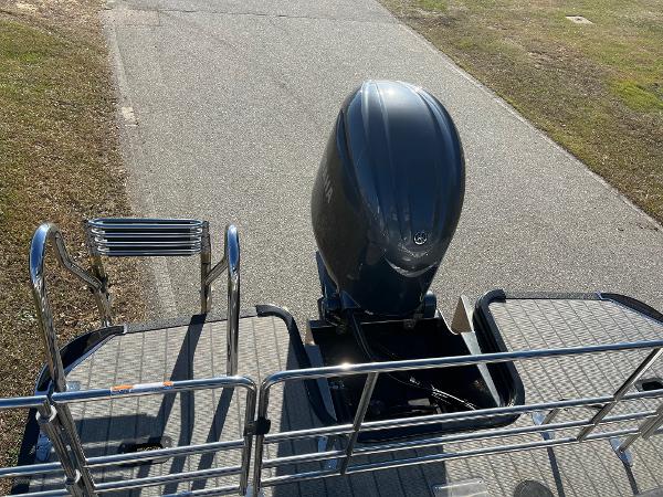 2024 Starcraft SLS3 boat with outboard motor and rear deck view.