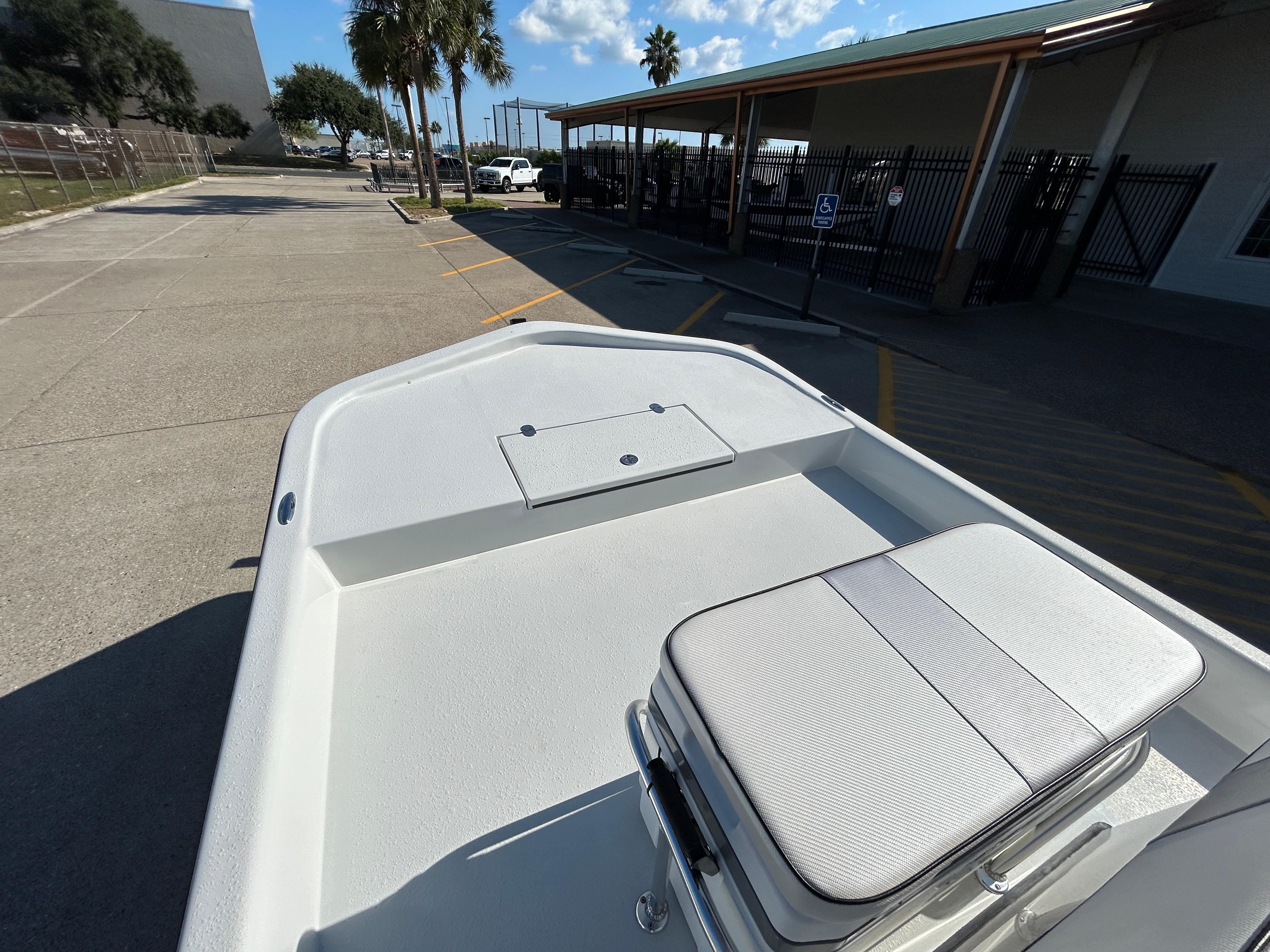 2025 Shallow Stalker Cat 204 boat, white deck, outdoor setting, sunny day.