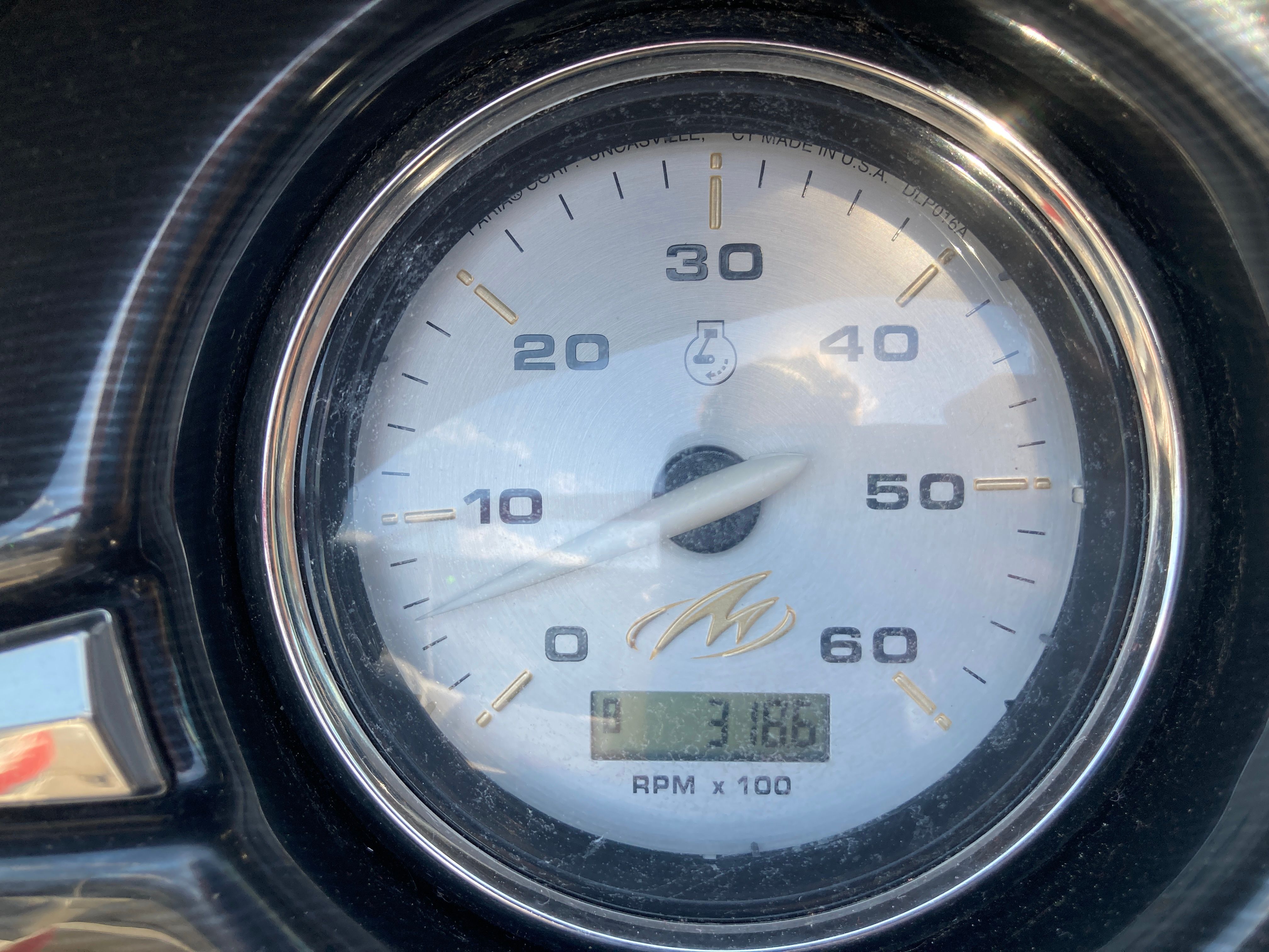 Tachometer of a 2012 Monterey 204FS boat, displaying 318 hours.