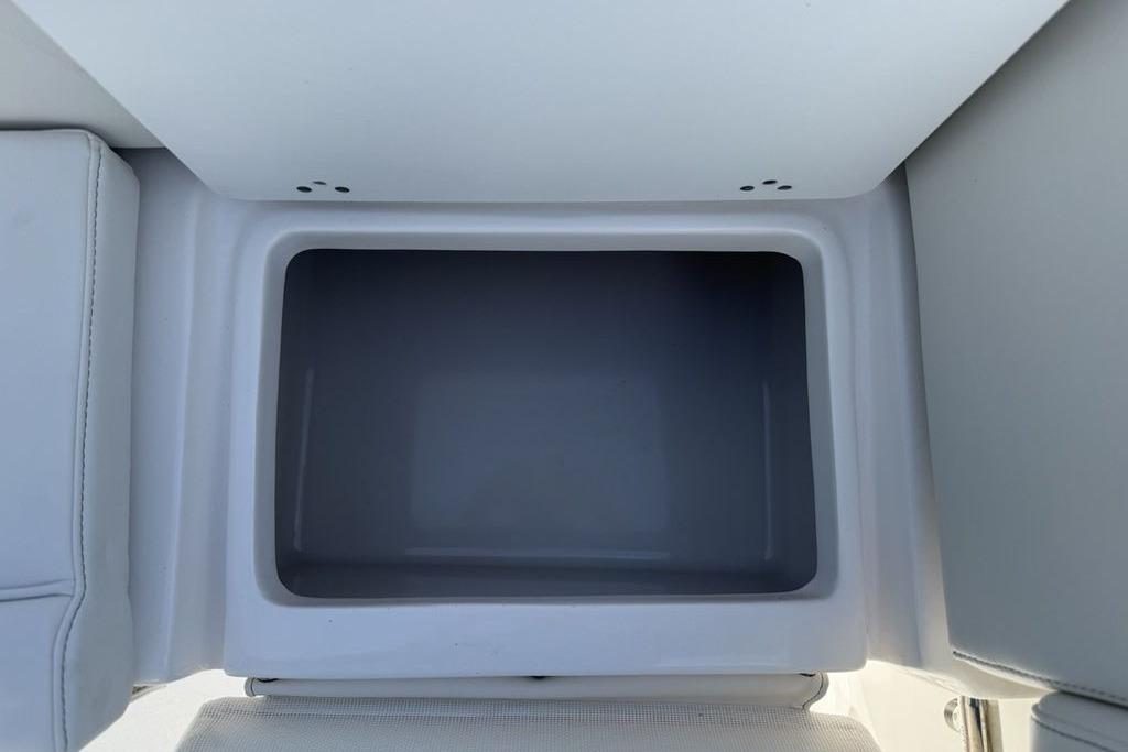 Storage compartment in 2026 Tidewater 232 LXF boat, featuring sleek design and ample space.