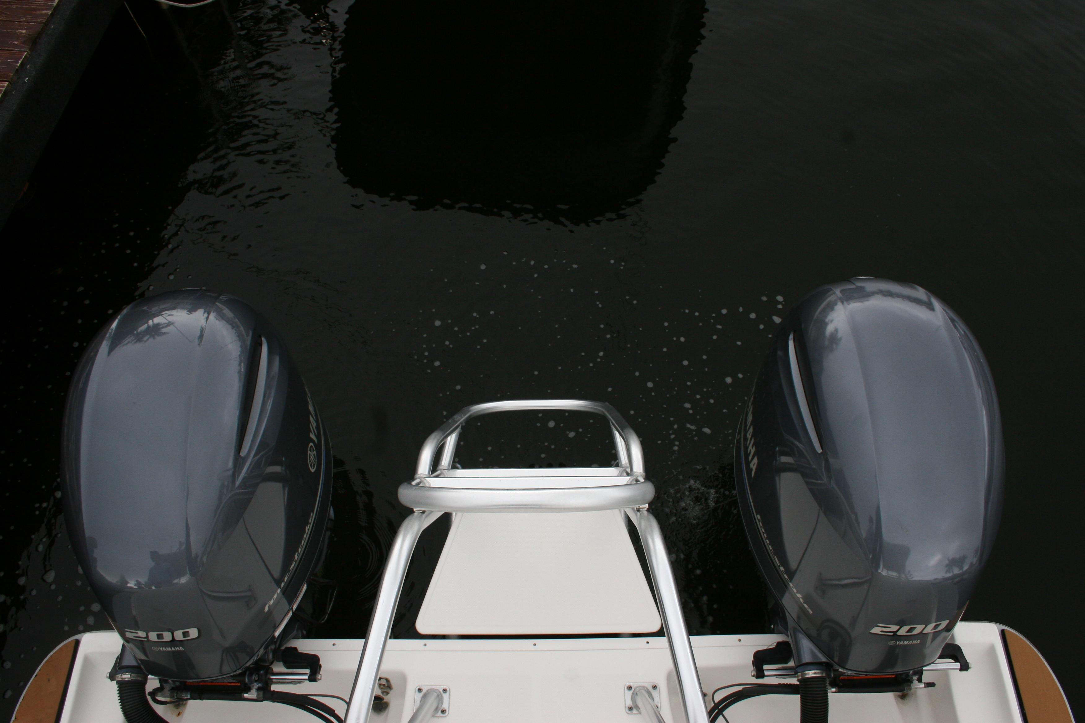 2021 World Cat 280 DC-X boat with dual 200 horsepower engines on water.