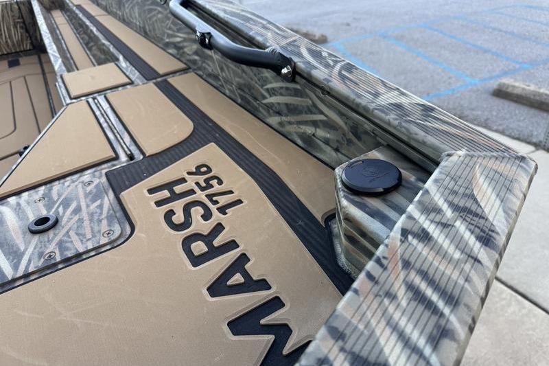 2026 Tracker Grizzly 1756 T Marsh boat interior with camo design and "Marsh 1756" label.