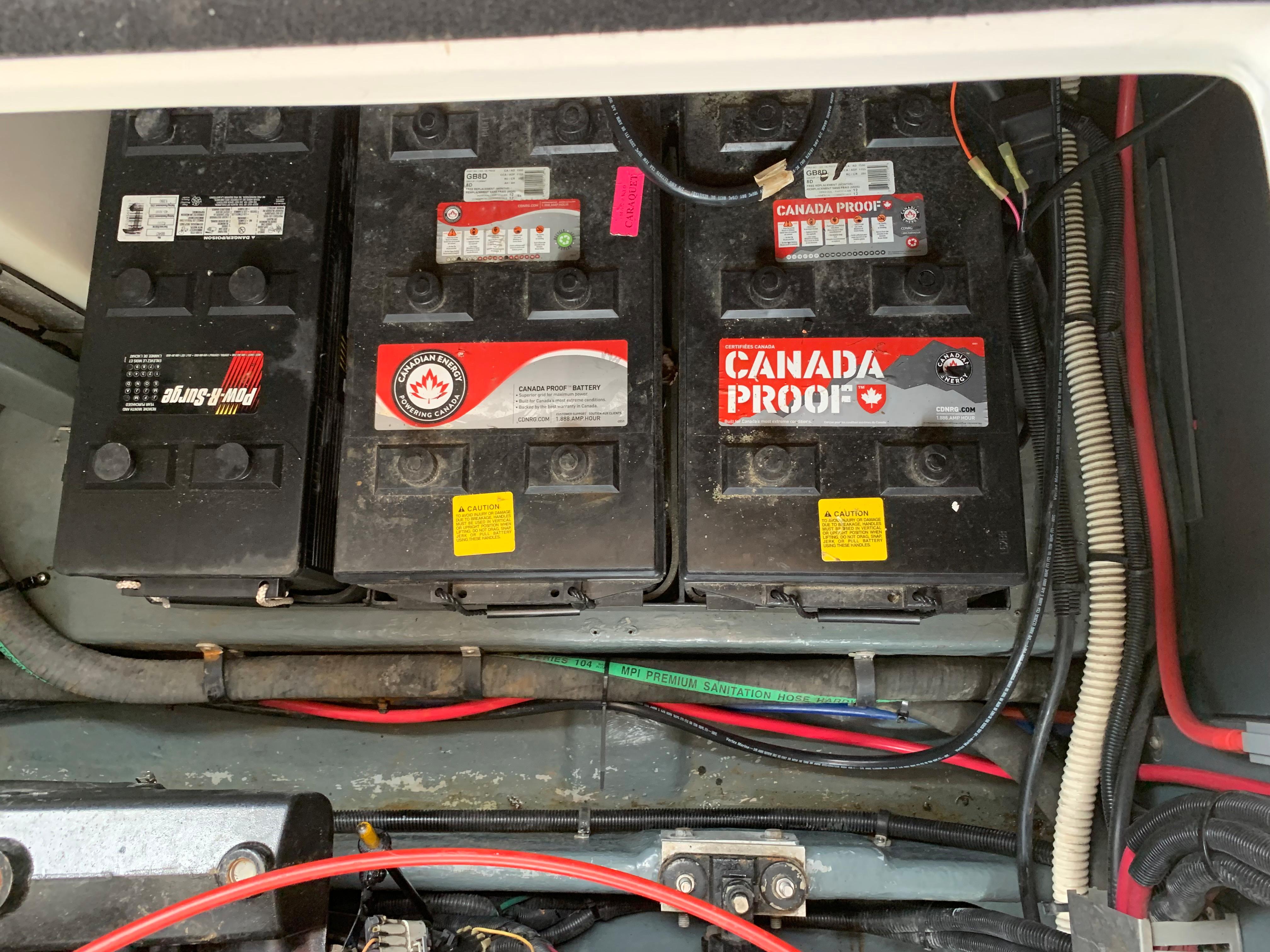Batteries in a 1997 Sea Ray 400 Sundancer boat engine compartment.