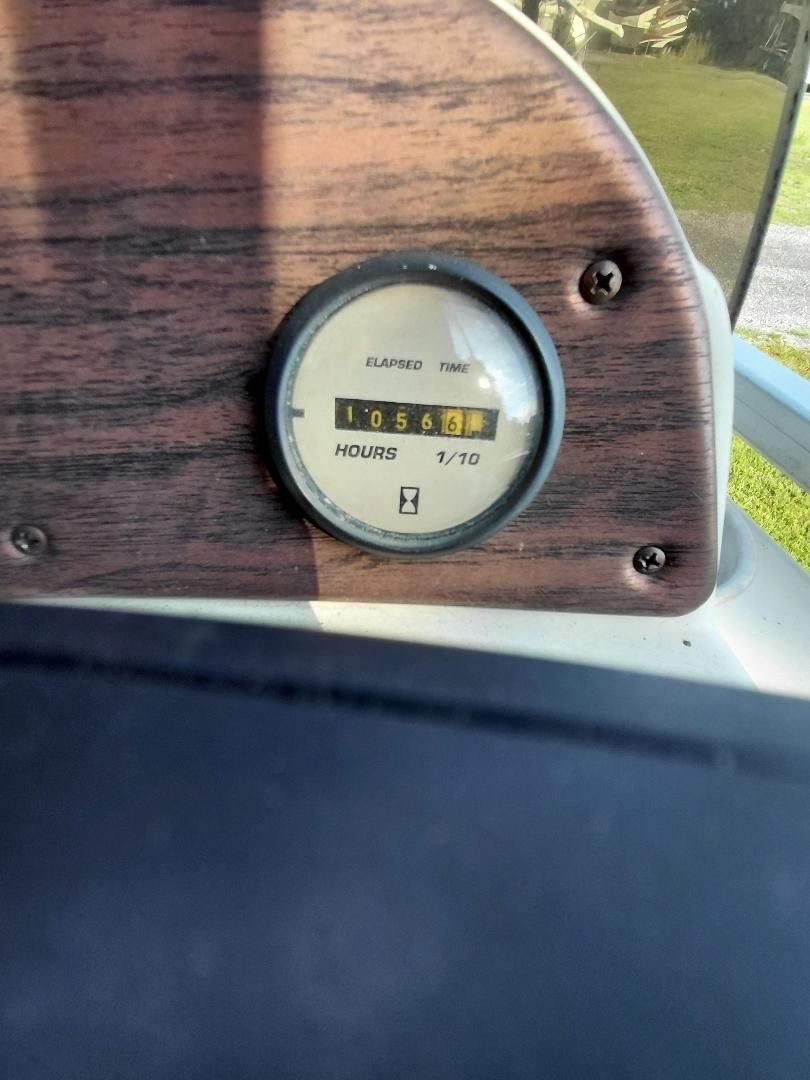 Close-up of an hour meter on a boat, displaying 1056.6 hours.