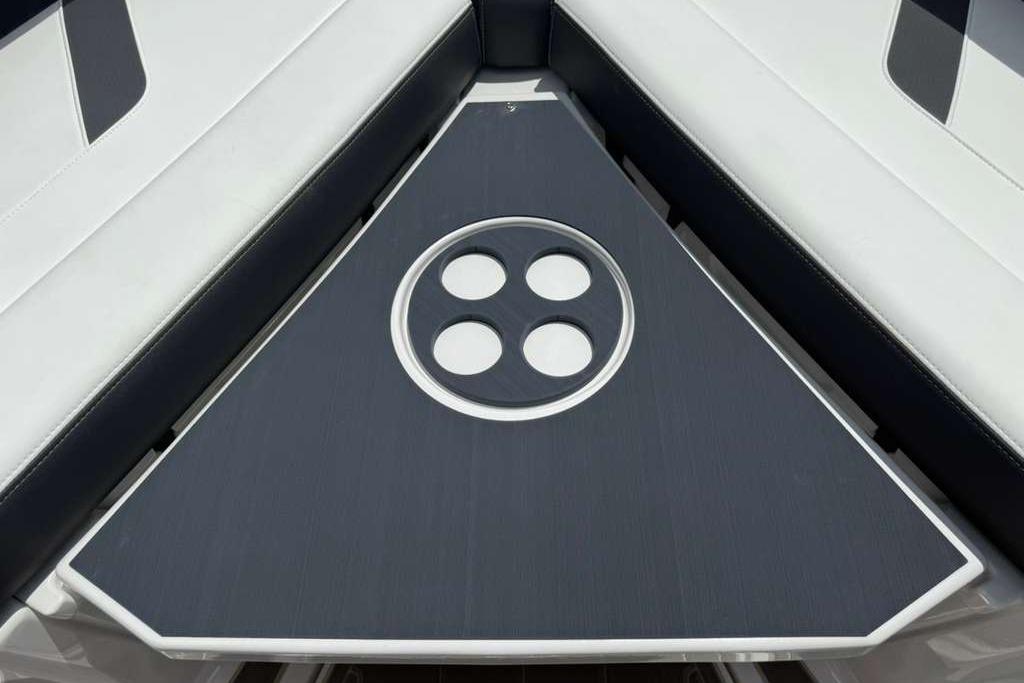 Luxury seating area on 2026 Monterey Elite 30 OB boat with stylish design.