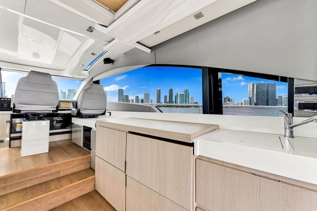 Interior of 2012 Fairline Targa 58 yacht with modern design and city skyline view.
