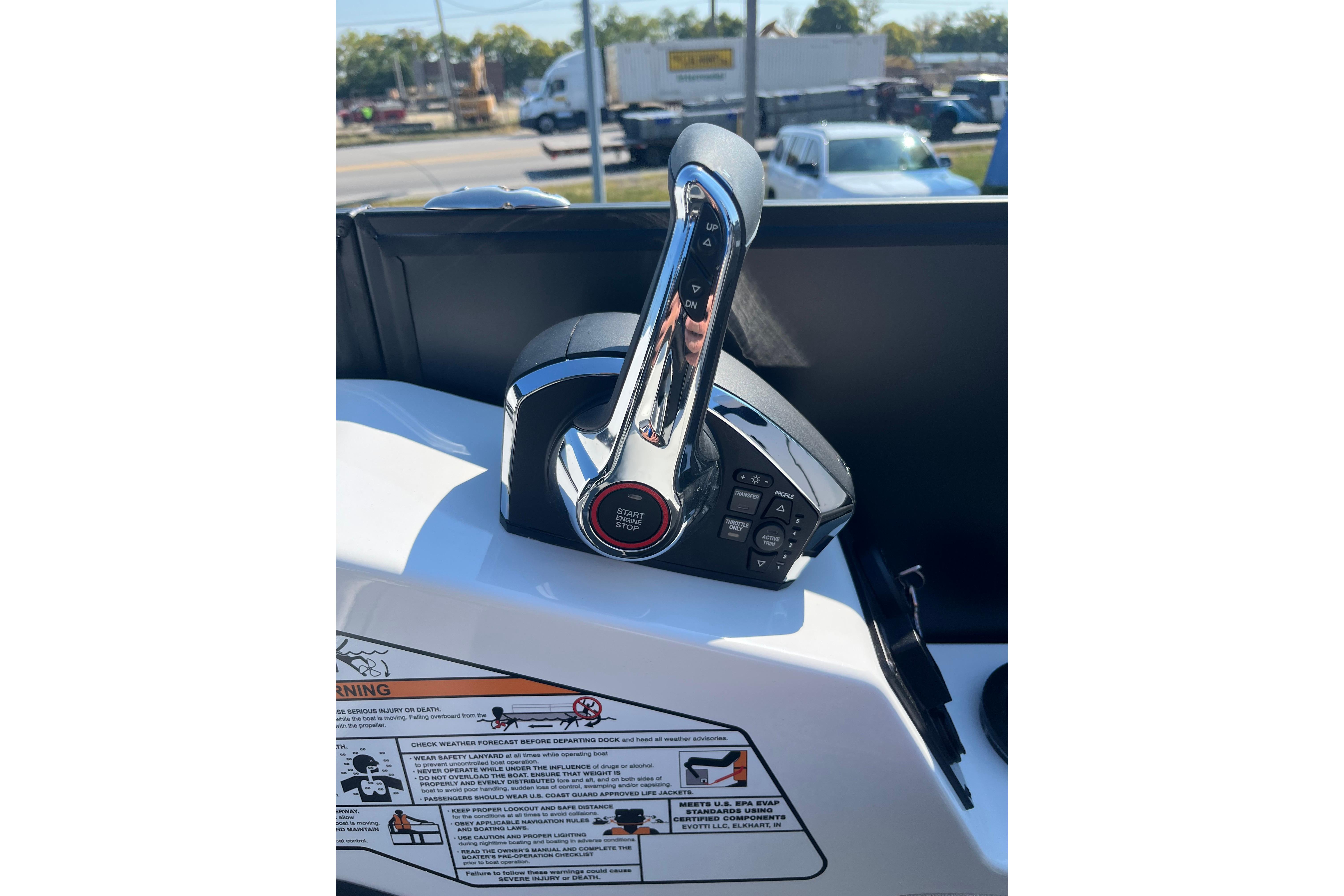 Close-up of Evotti 725CS boat throttle control, 2026 model, with start/stop button.