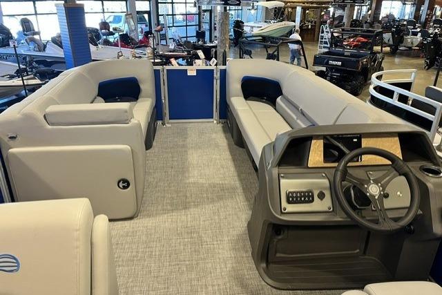 2026 Sun Tracker Party Barge 20 DLX interior with spacious seating and modern helm.