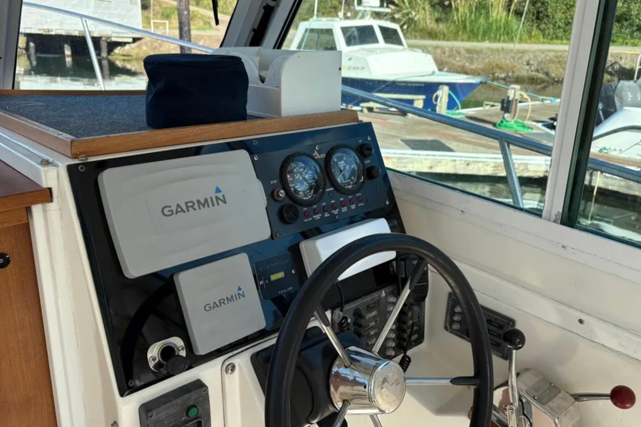 Helm of 2005 Albin 28 Tournament Express with Garmin navigation equipment.